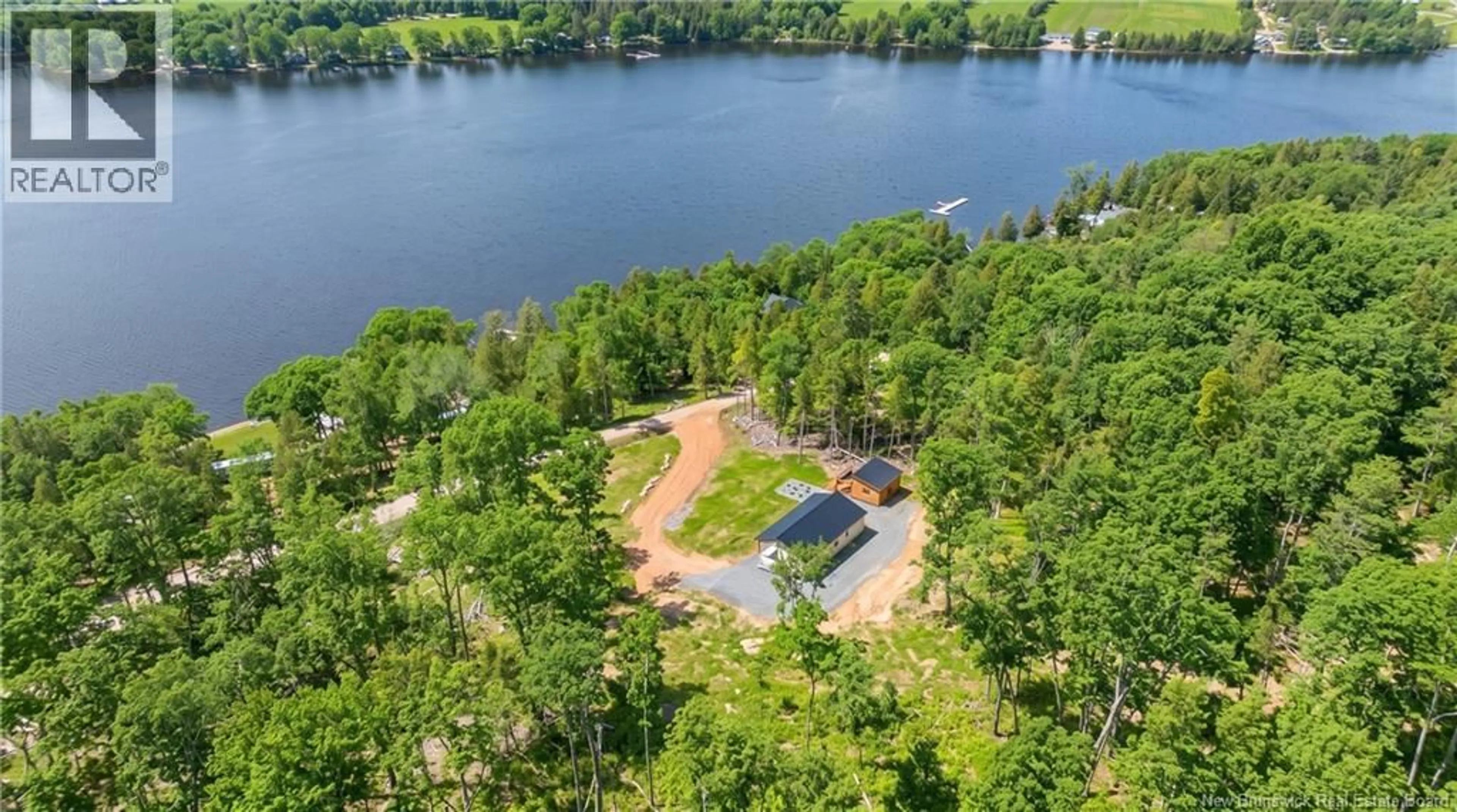 A pic from outside/outdoor area/front of a property/back of a property/a pic from drone, water/lake/river/ocean view for 97 BROWNS COVE ROAD, Kars New Brunswick E5T2Z5