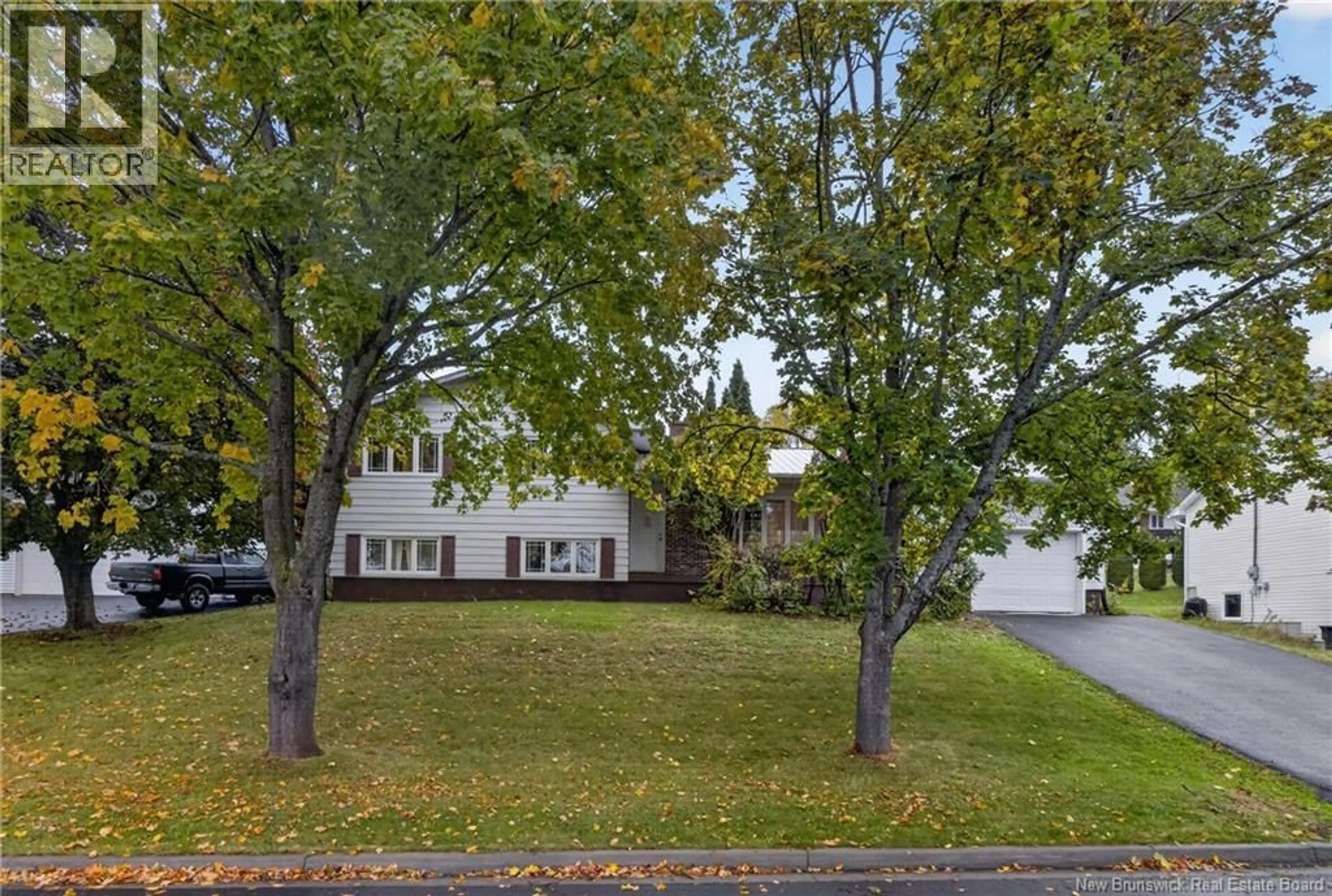A pic from outside/outdoor area/front of a property/back of a property/a pic from drone, street for 74 TALISMAN CRESCENT, Fredericton New Brunswick E3C1L9