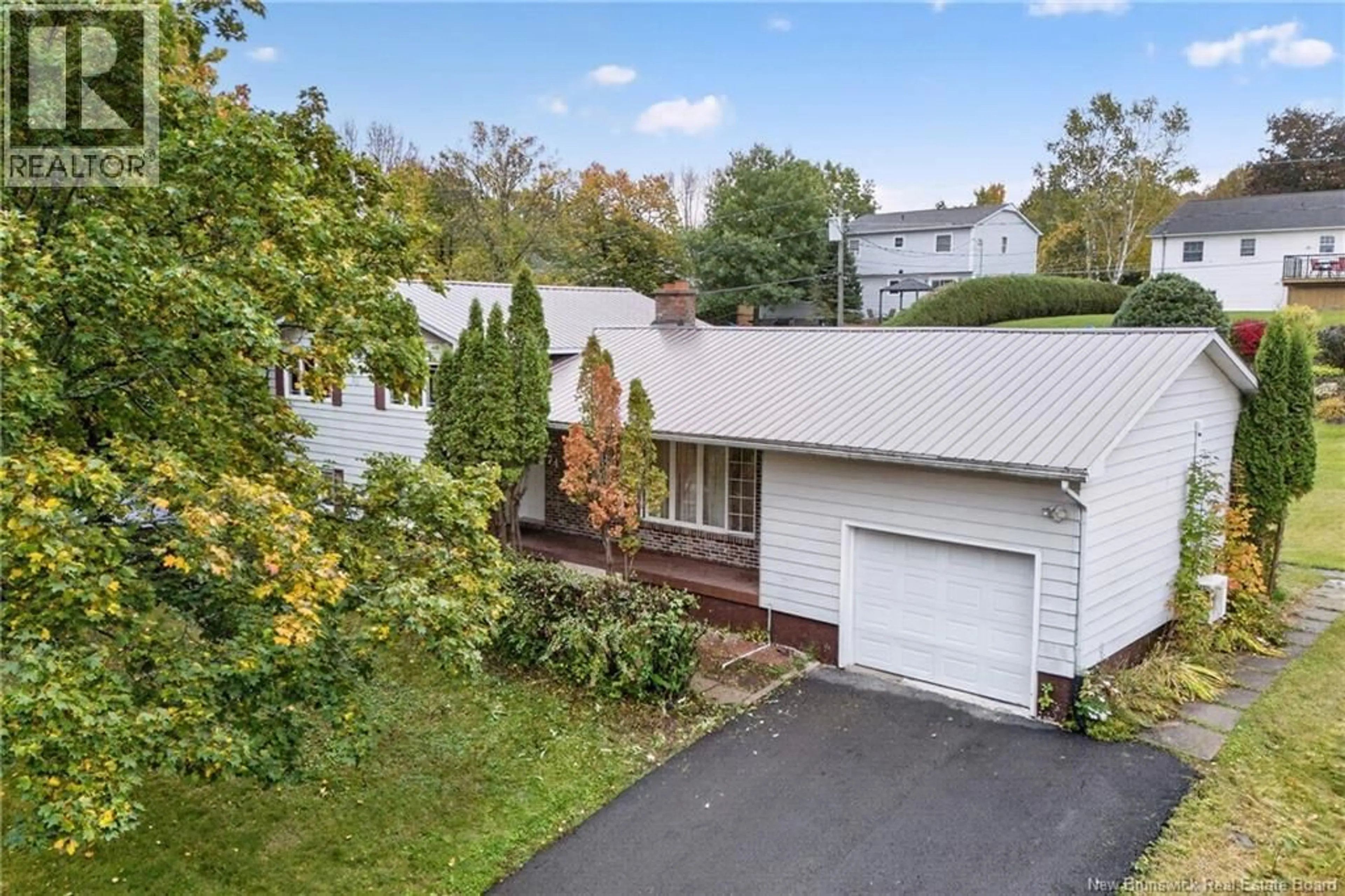 A pic from outside/outdoor area/front of a property/back of a property/a pic from drone, street for 74 TALISMAN CRESCENT, Fredericton New Brunswick E3C1L9