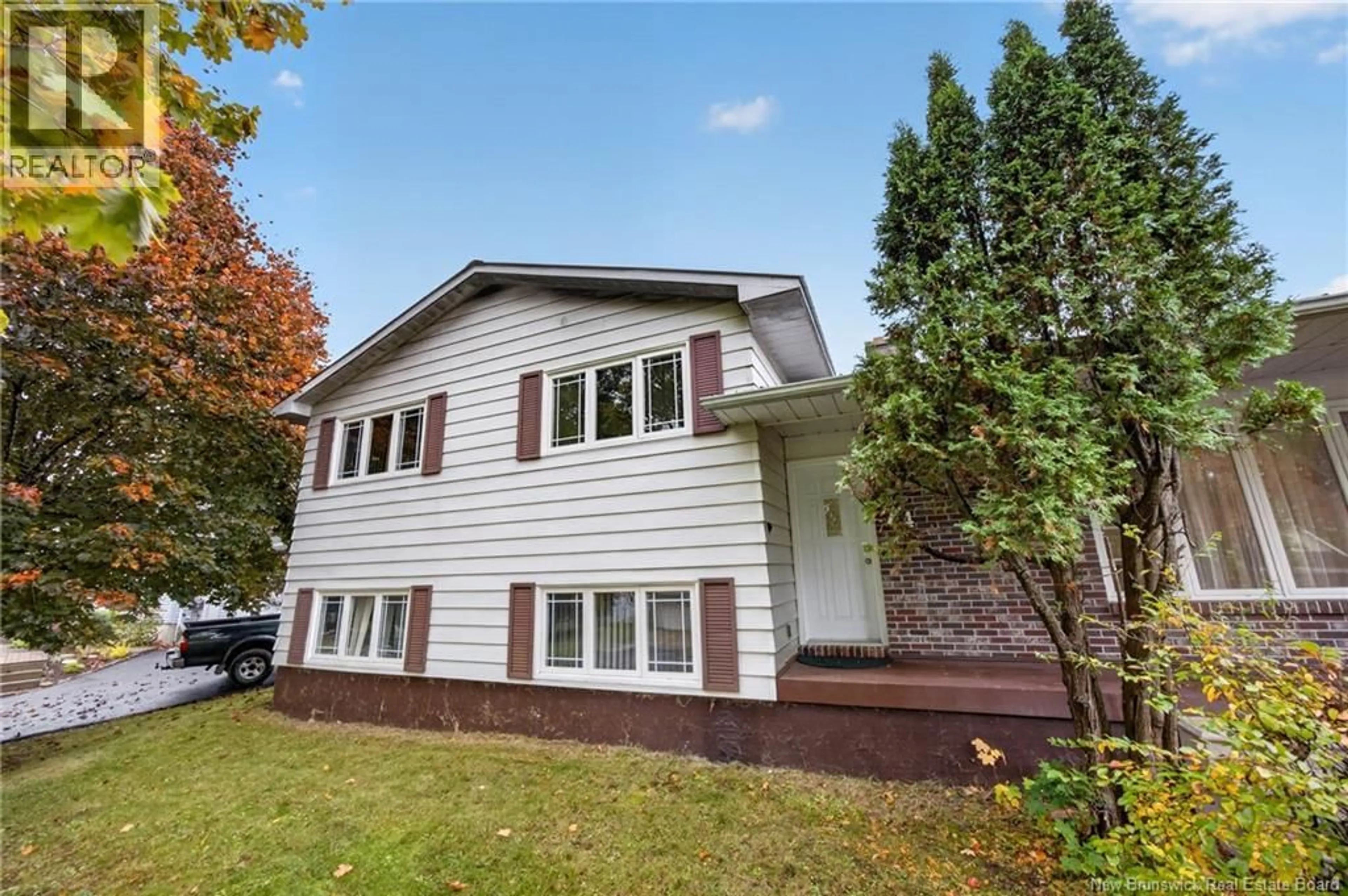 Home with vinyl exterior material, street for 74 TALISMAN CRESCENT, Fredericton New Brunswick E3C1L9