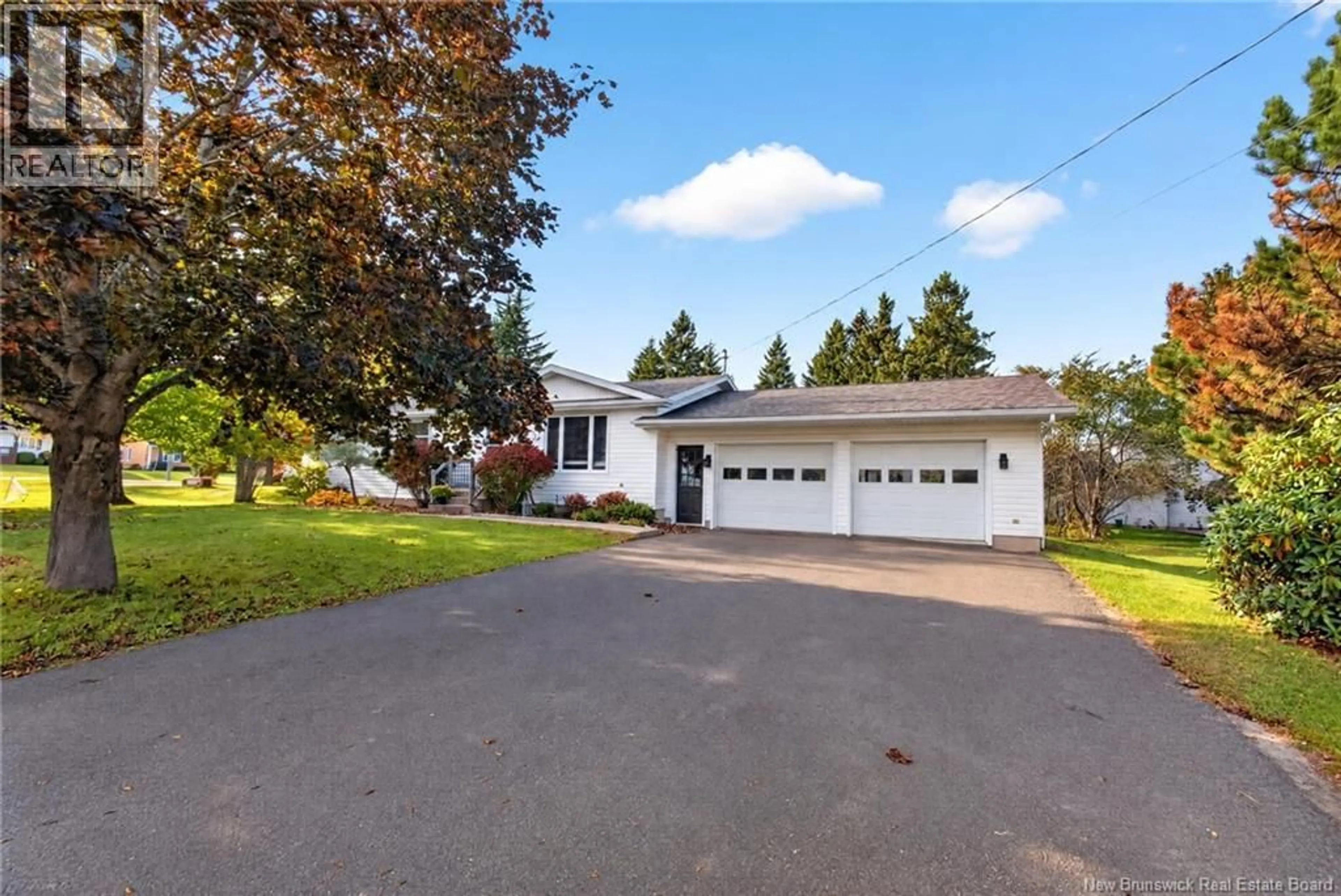 Home with vinyl exterior material, street for 21 CHAMPLAIN, Bouctouche New Brunswick E4S2Y7