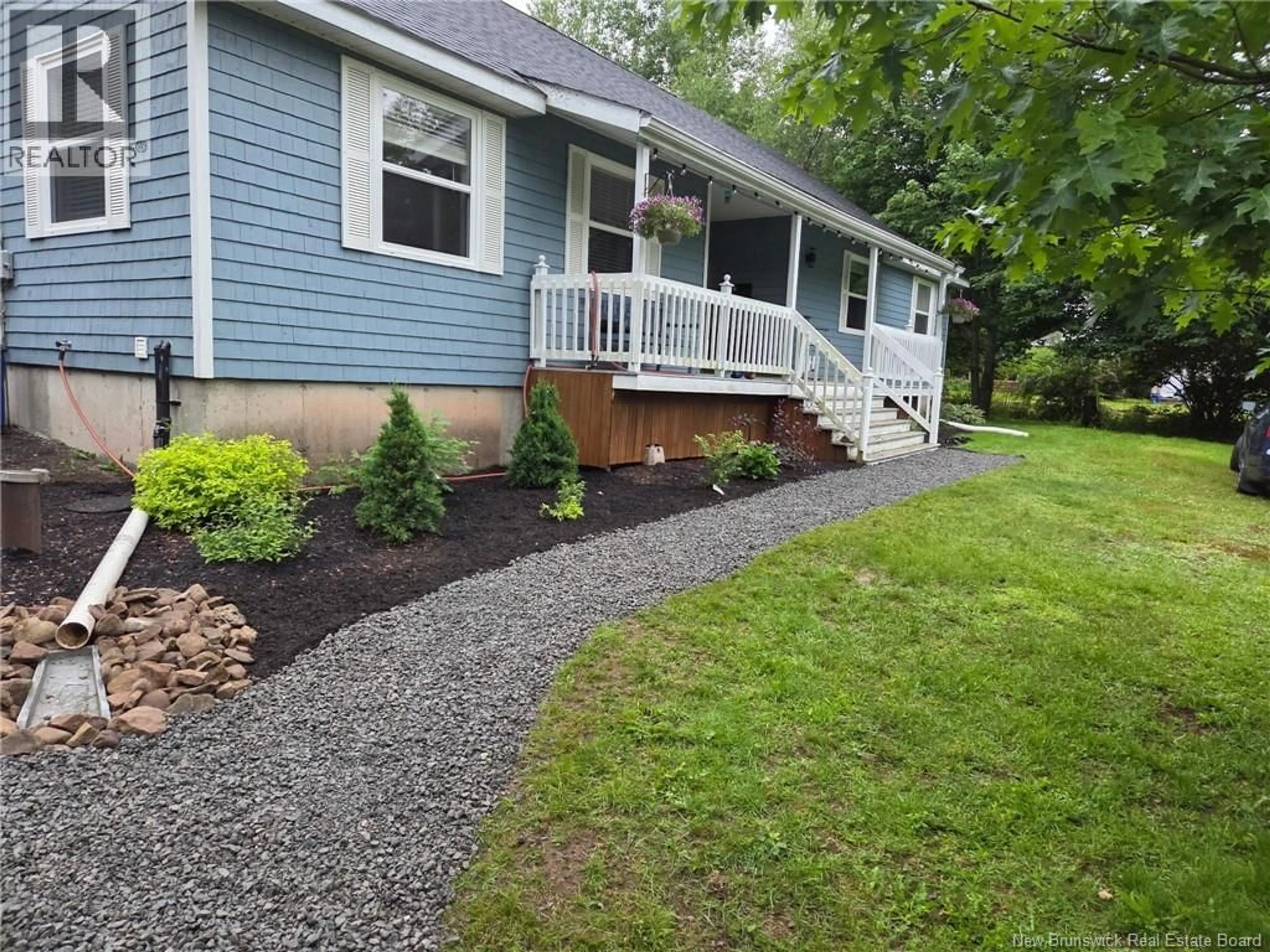 Home with vinyl exterior material, street for 32 RIVERBEND, Turtle Creek New Brunswick E1J2B3