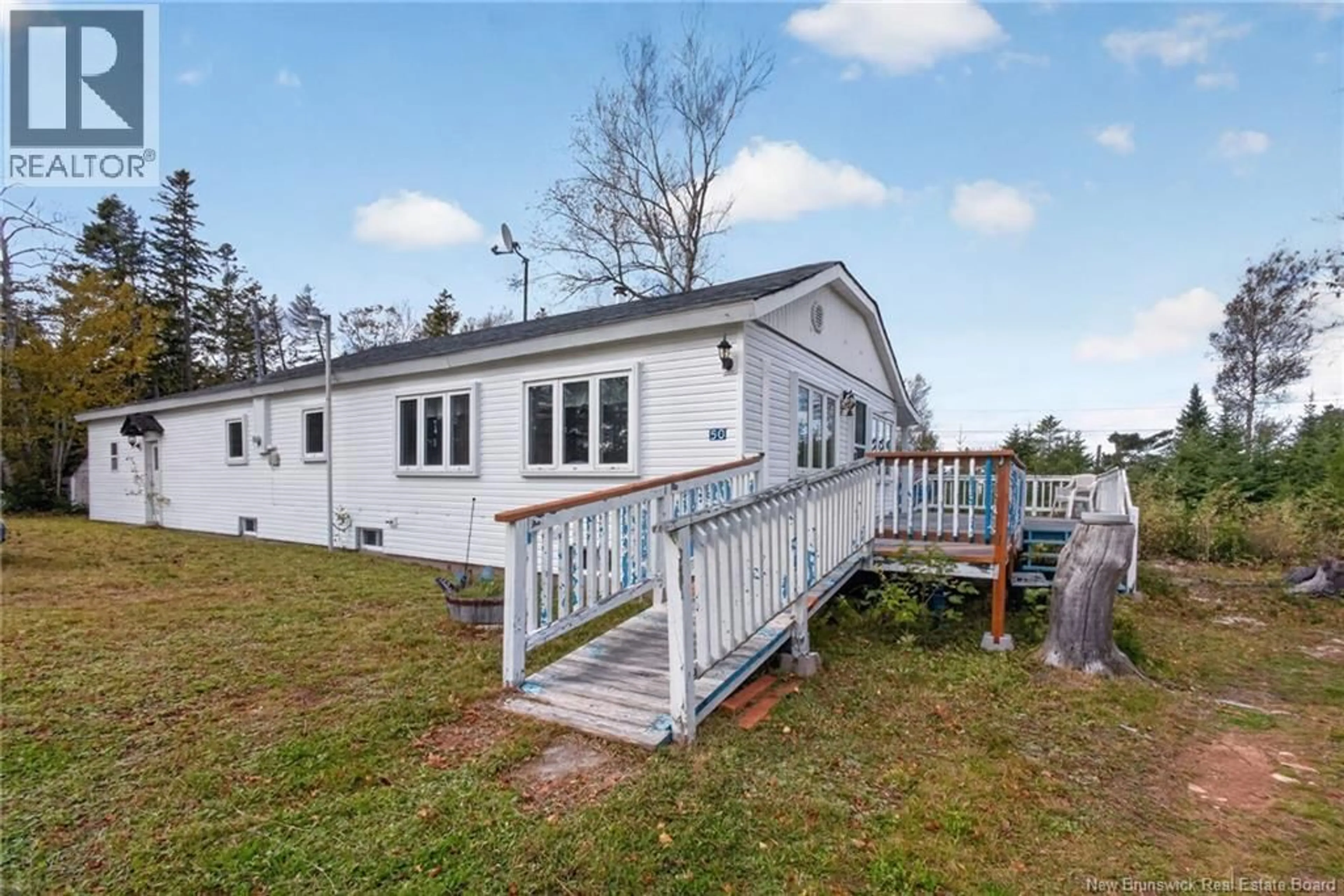 A pic from outside/outdoor area/front of a property/back of a property/a pic from drone, water/lake/river/ocean view for 50 WOODLAND BOULEVARD, Grande-Digue New Brunswick E4R5X9