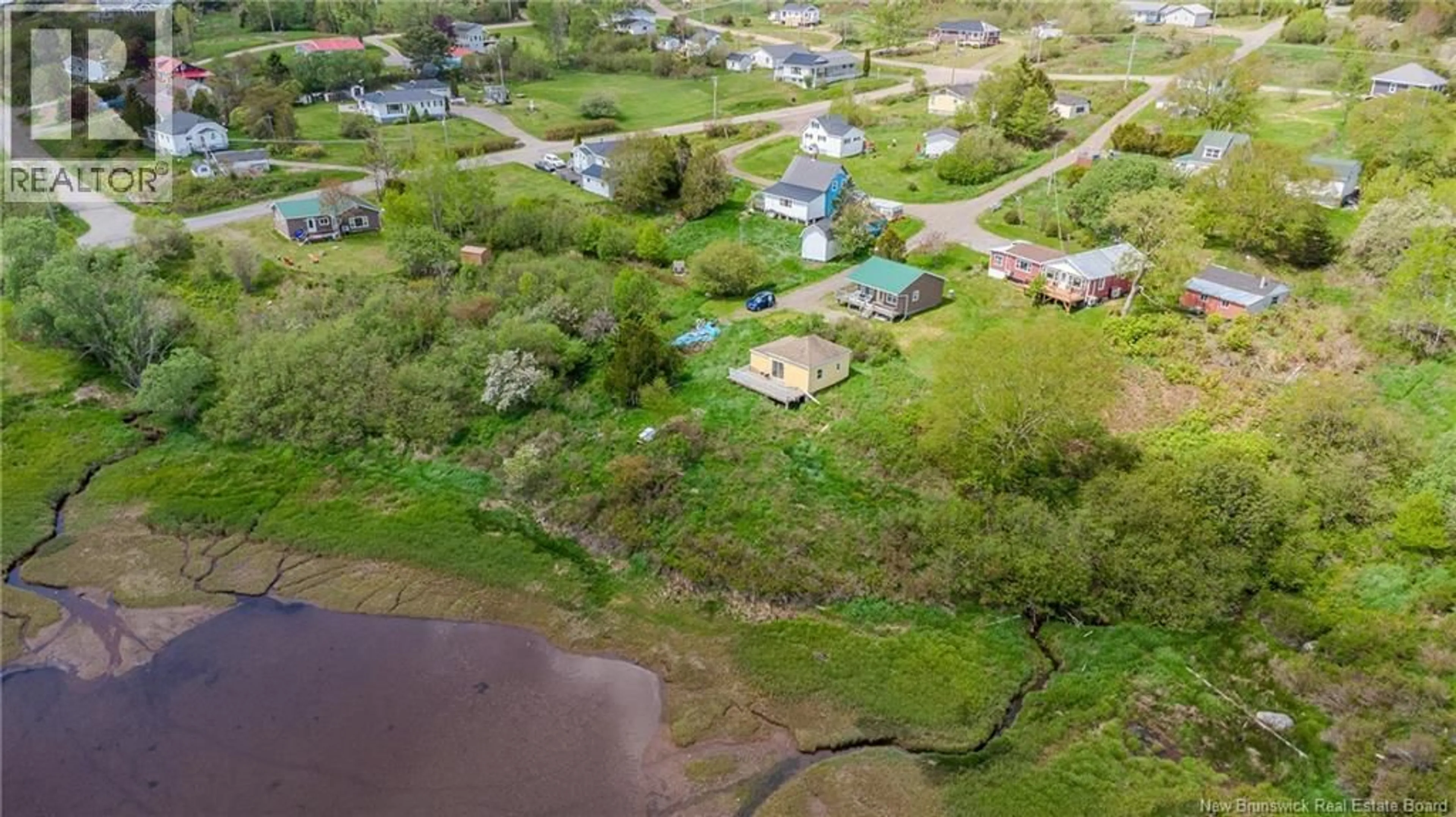 A pic from outside/outdoor area/front of a property/back of a property/a pic from drone, water/lake/river/ocean view for 15 FUNDY VIEW DRIVE, Back Bay New Brunswick E5C2X8