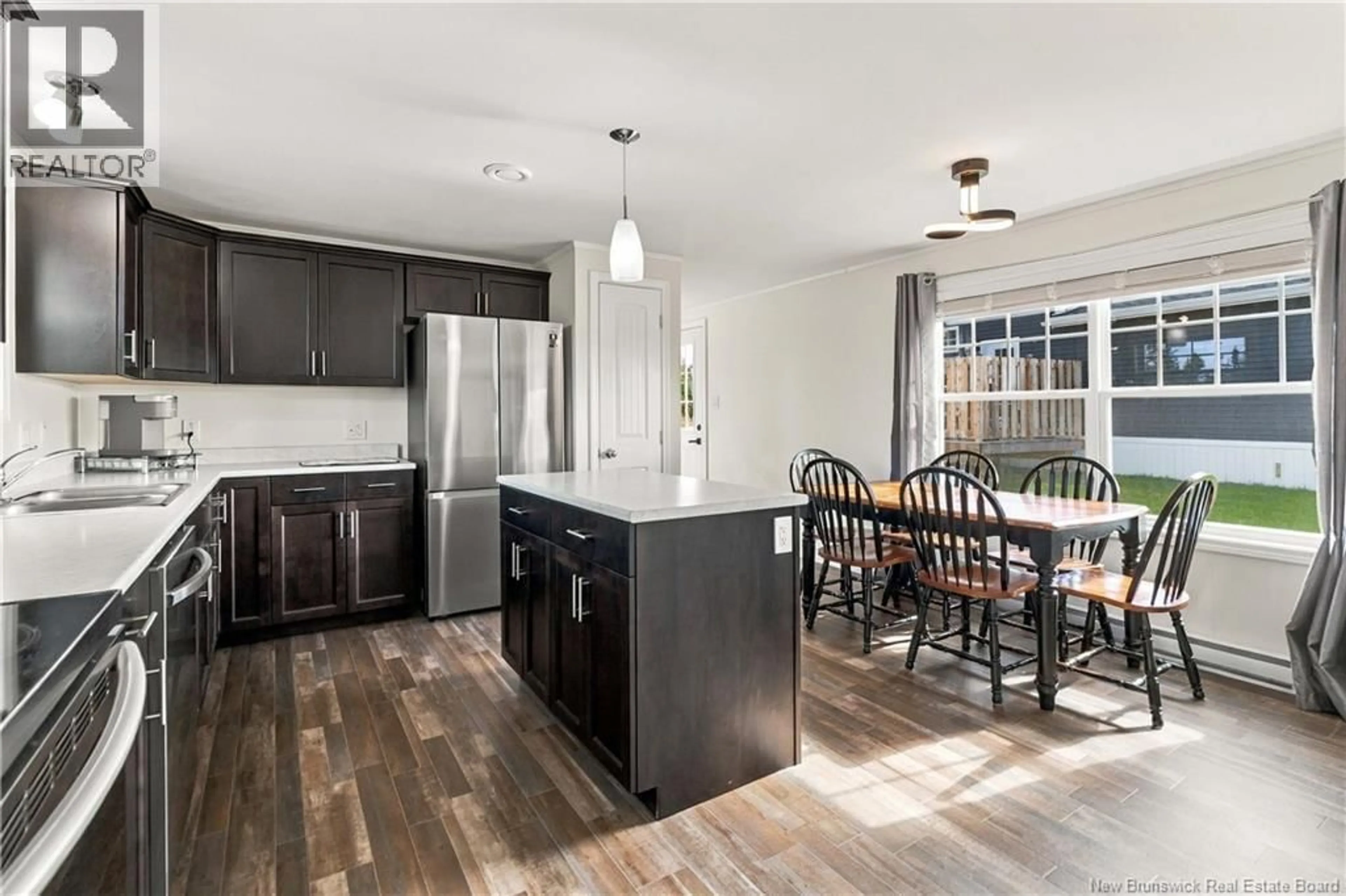 Open concept kitchen, wood/laminate floor for 52 CRANBROOK LANE, Riverview New Brunswick E1B0N6