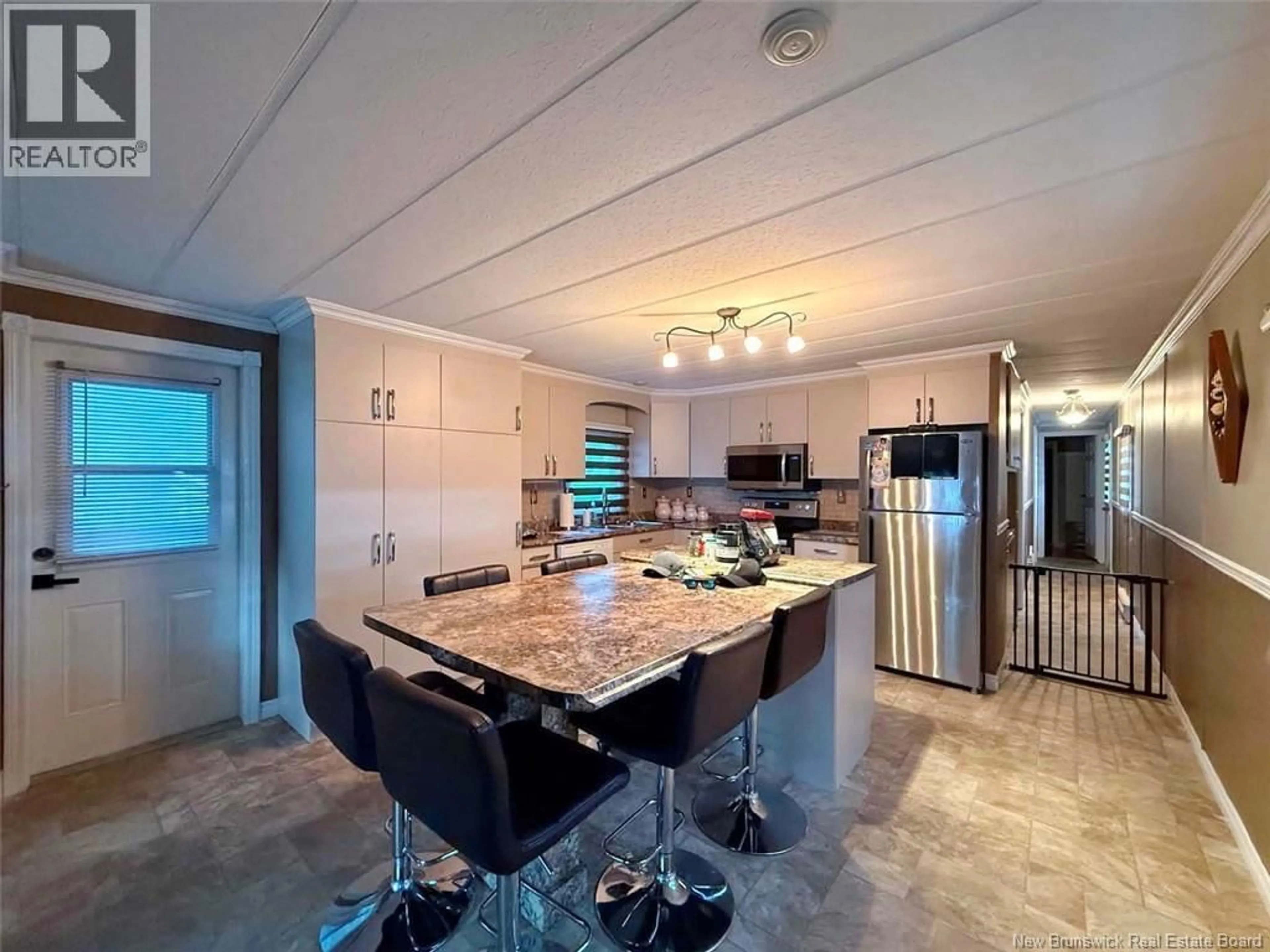 Open concept kitchen, ceramic/tile floor for 11 PARC P'TISO STREET, Edmundston New Brunswick E3V3X7
