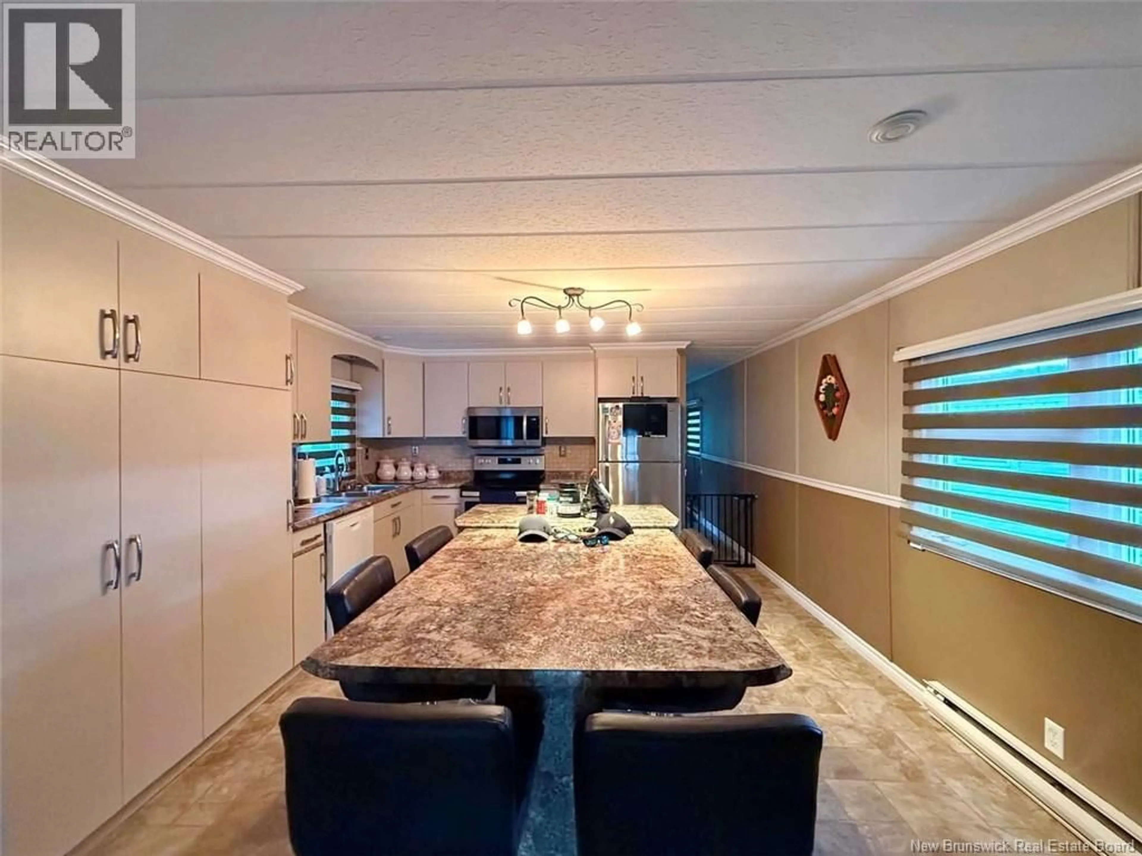 Open concept kitchen, ceramic/tile floor for 11 PARC P'TISO STREET, Edmundston New Brunswick E3V3X7