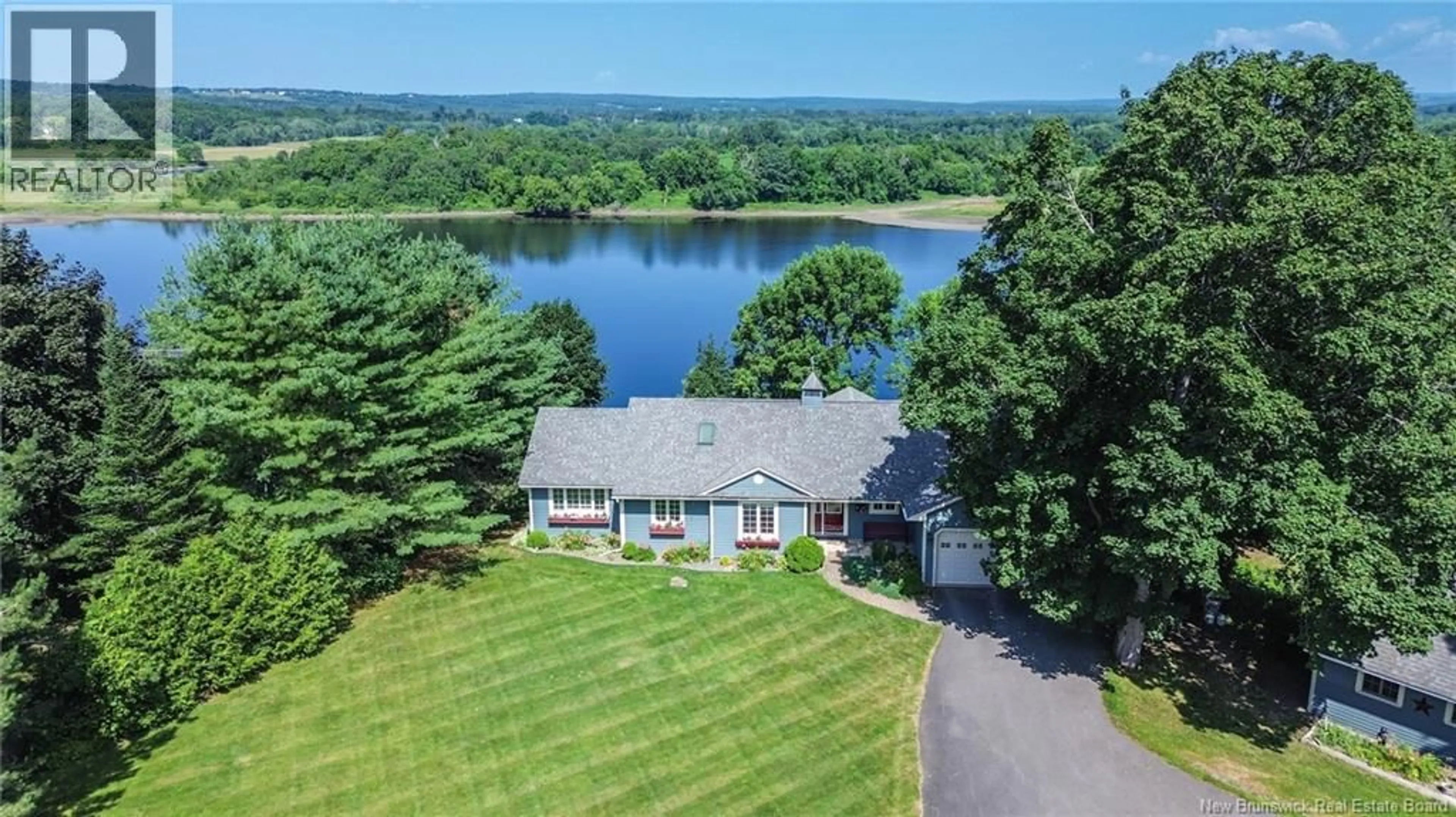 A pic from outside/outdoor area/front of a property/back of a property/a pic from drone, water/lake/river/ocean view for 14 EAGLE COURT, Island View New Brunswick E3E2G7