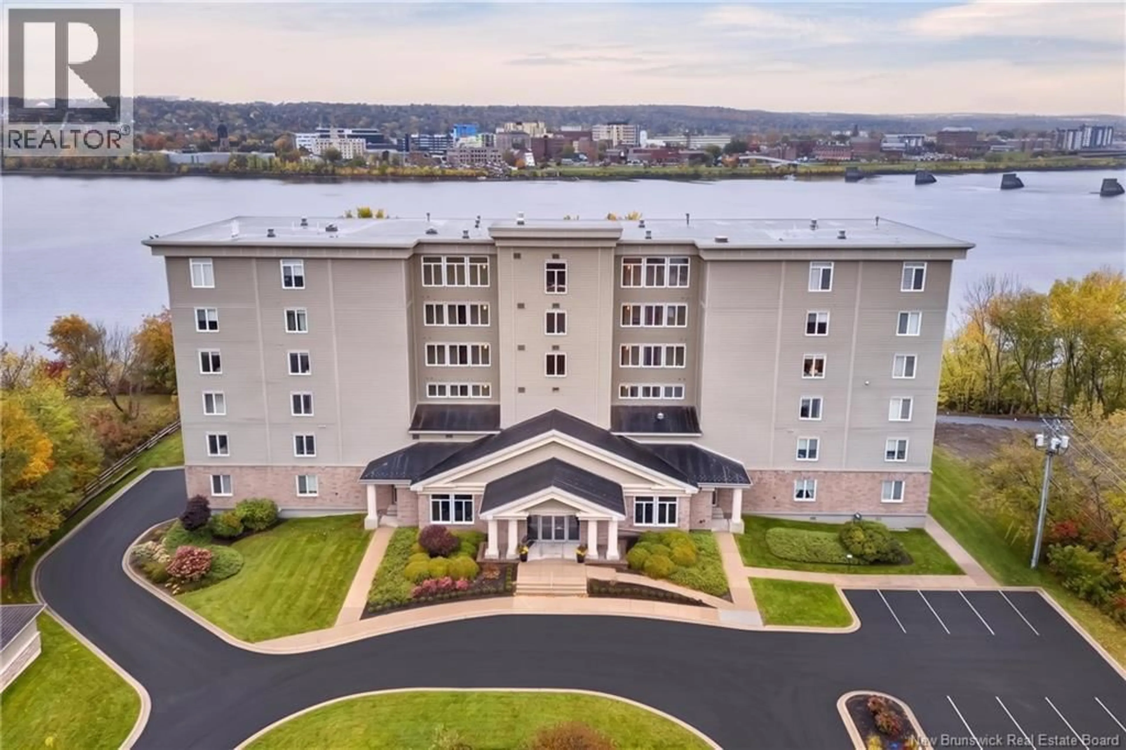 A pic from outside/outdoor area/front of a property/back of a property/a pic from drone, water/lake/river/ocean view for 201 - 1 SOUTHVIEW LANE LANE, Fredericton New Brunswick E3A5V3