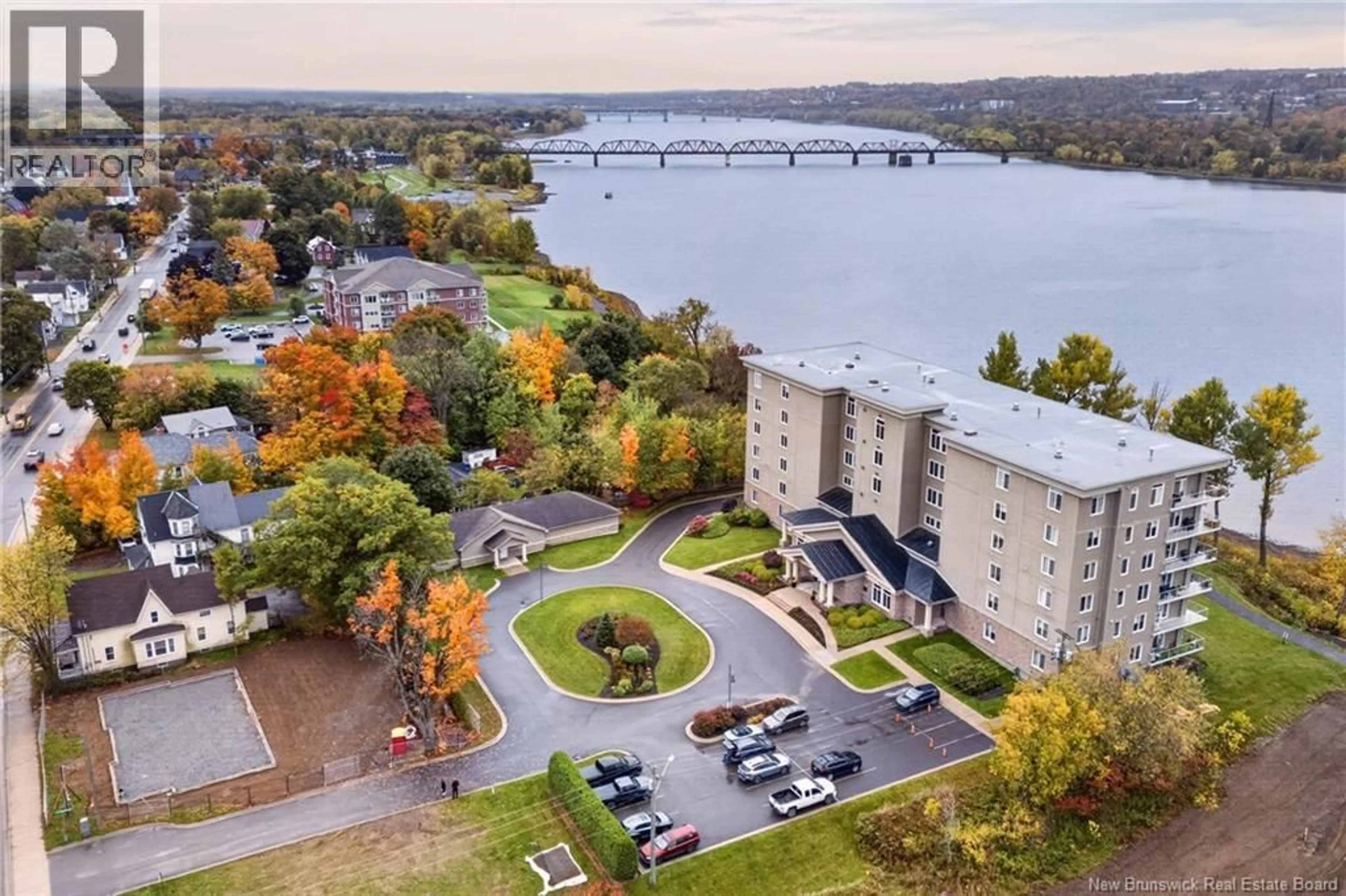 A pic from outside/outdoor area/front of a property/back of a property/a pic from drone, water/lake/river/ocean view for 201 - 1 SOUTHVIEW LANE LANE, Fredericton New Brunswick E3A5V3