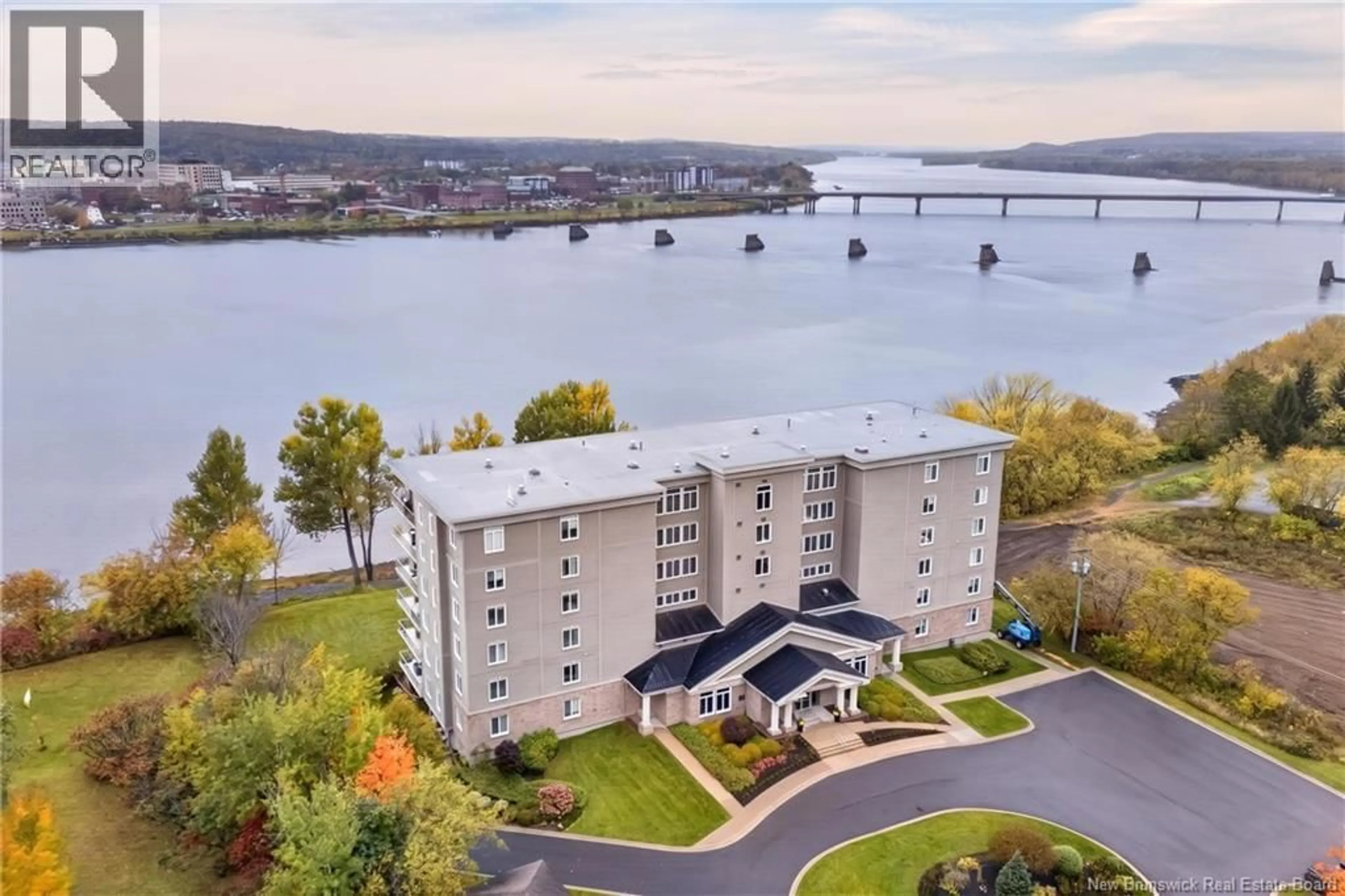 A pic from outside/outdoor area/front of a property/back of a property/a pic from drone, water/lake/river/ocean view for 201 - 1 SOUTHVIEW LANE LANE, Fredericton New Brunswick E3A5V3