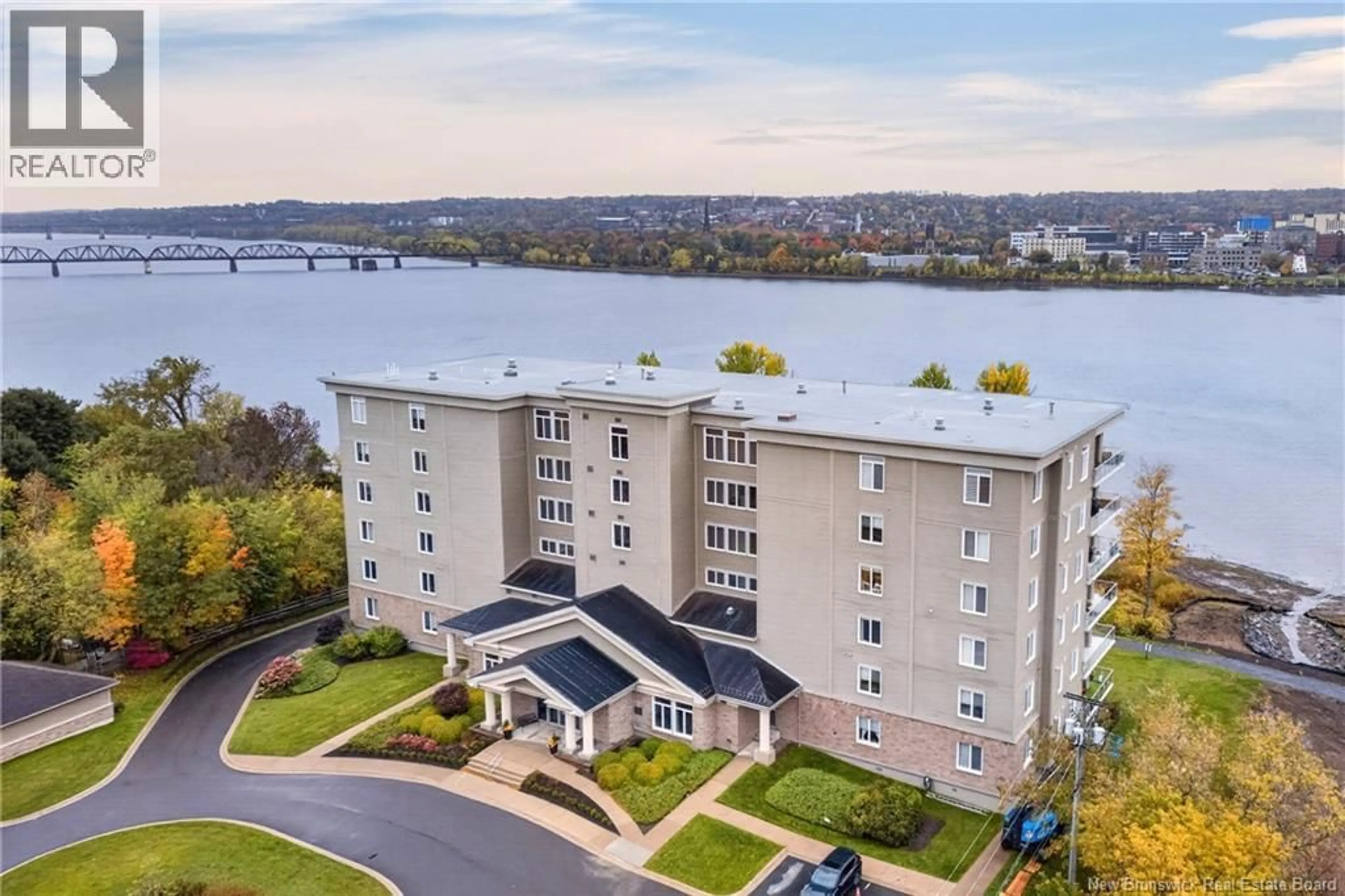 A pic from outside/outdoor area/front of a property/back of a property/a pic from drone, water/lake/river/ocean view for 201 - 1 SOUTHVIEW LANE LANE, Fredericton New Brunswick E3A5V3