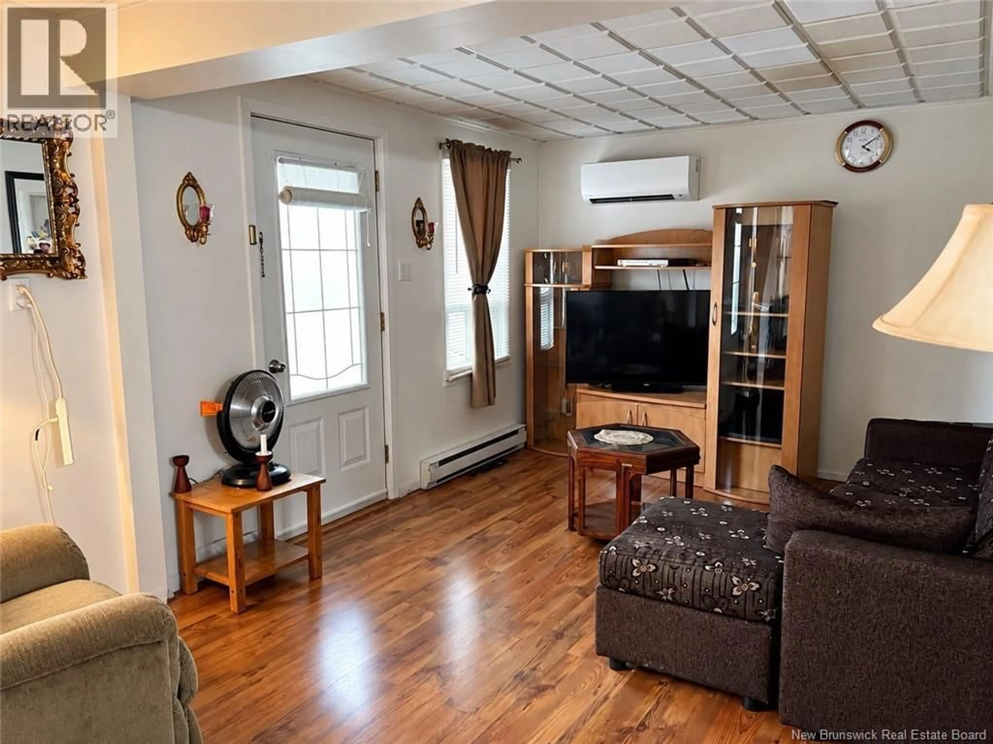 Living room with furniture, wood/laminate floor for 145 ISIDORE BOUCHER, Saint-Jacques New Brunswick E7B1W3