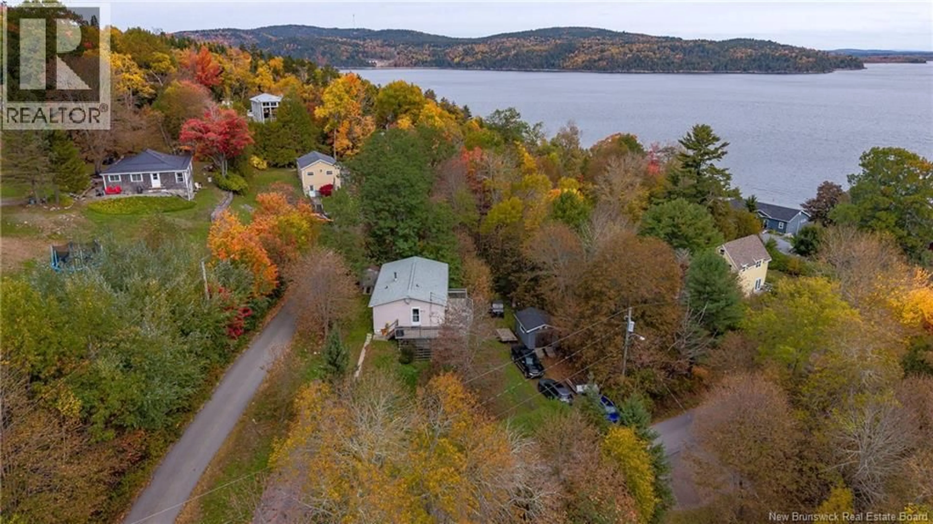 A pic from outside/outdoor area/front of a property/back of a property/a pic from drone, water/lake/river/ocean view for 1 POINTS ROAD, Grand Bay-Westfield New Brunswick E5K2L5
