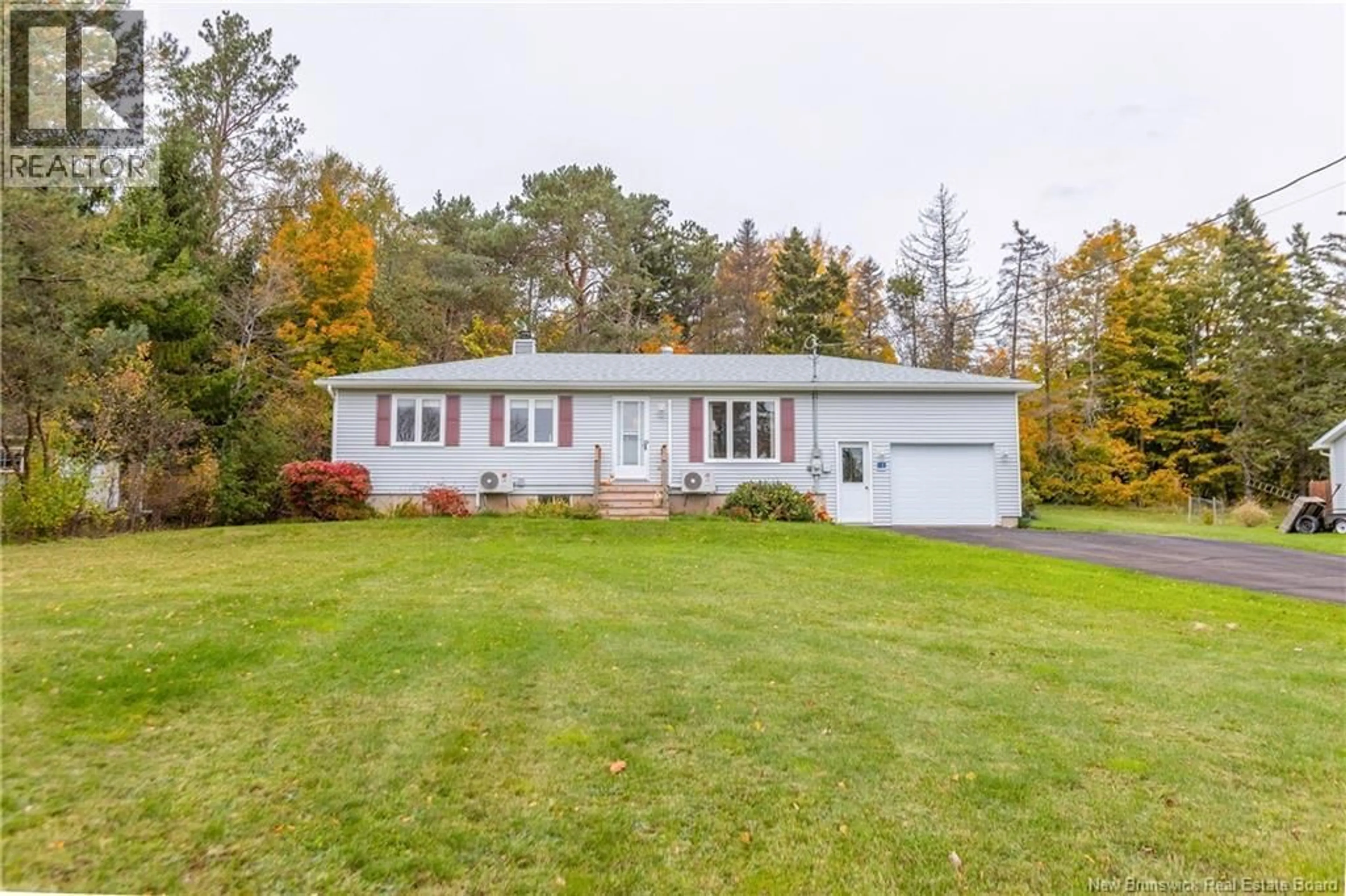 Home with vinyl exterior material, street for 18 HARRIS DRIVE, Sackville New Brunswick E4L3X6