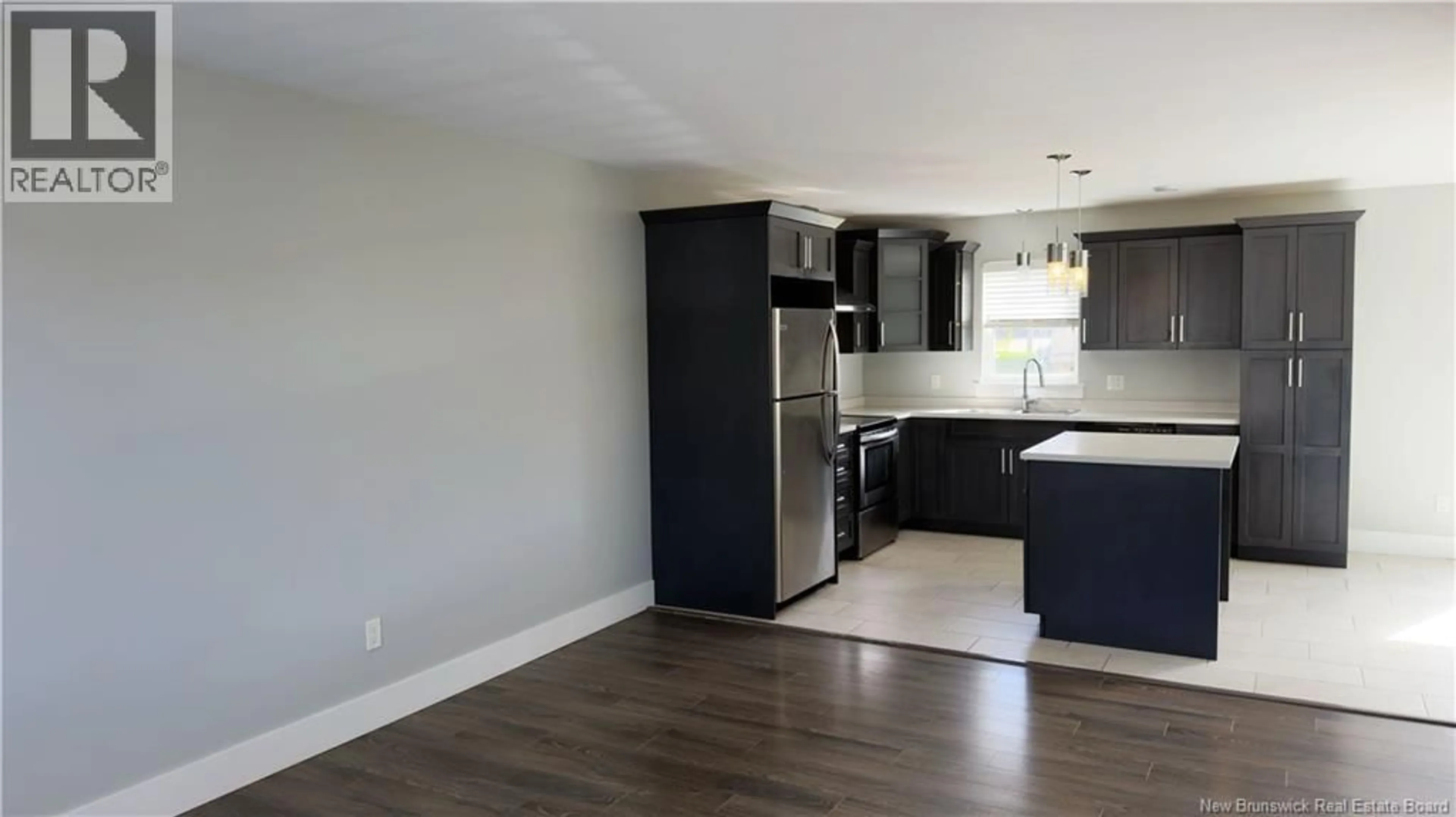 Open concept kitchen, wood/laminate floor for 57 DES PEUPLIERS STREET, Dieppe New Brunswick E1A9E4
