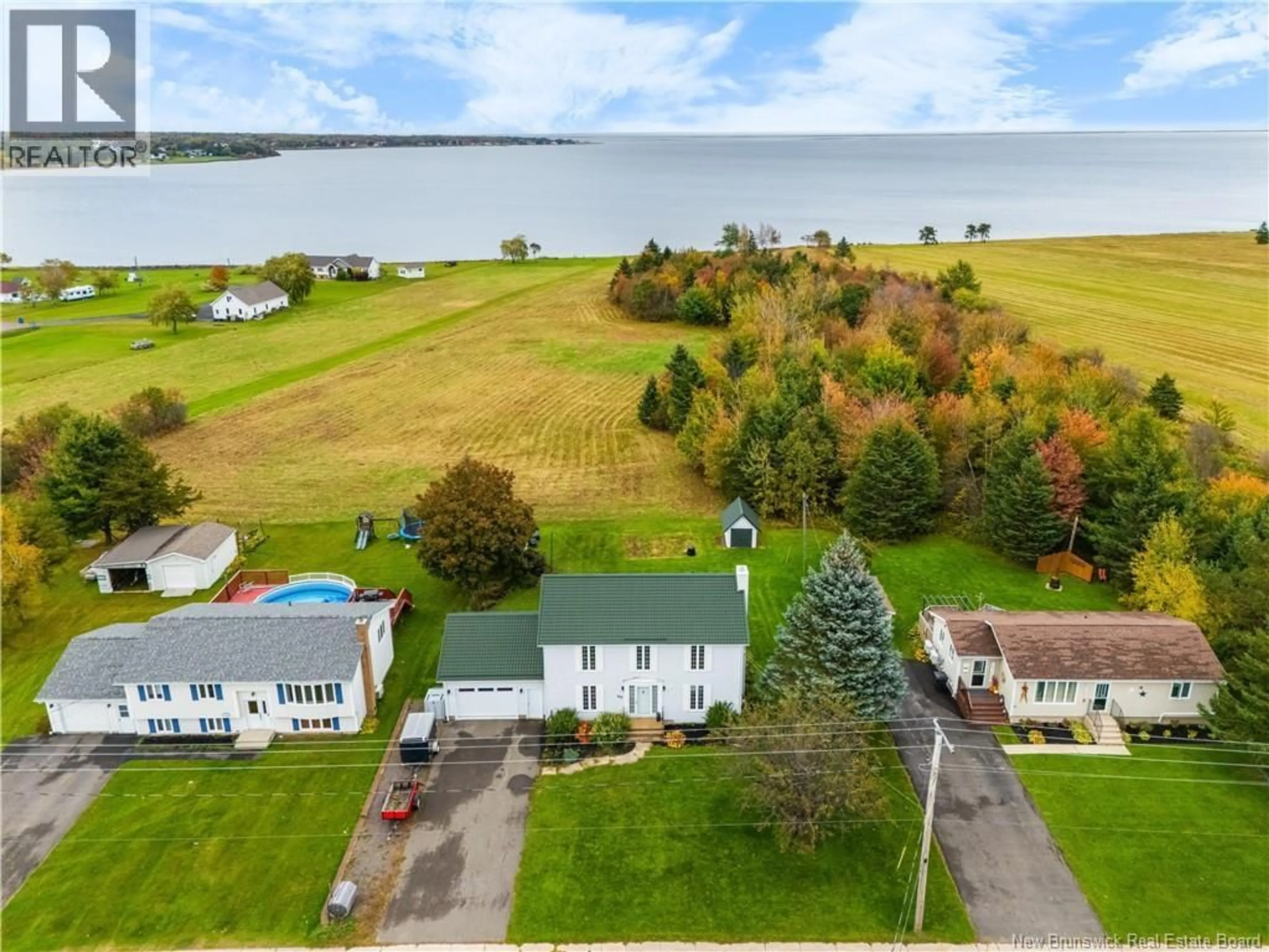 A pic from outside/outdoor area/front of a property/back of a property/a pic from drone, water/lake/river/ocean view for 90 RUE ACADIE, Bouctouche New Brunswick E4S2T4