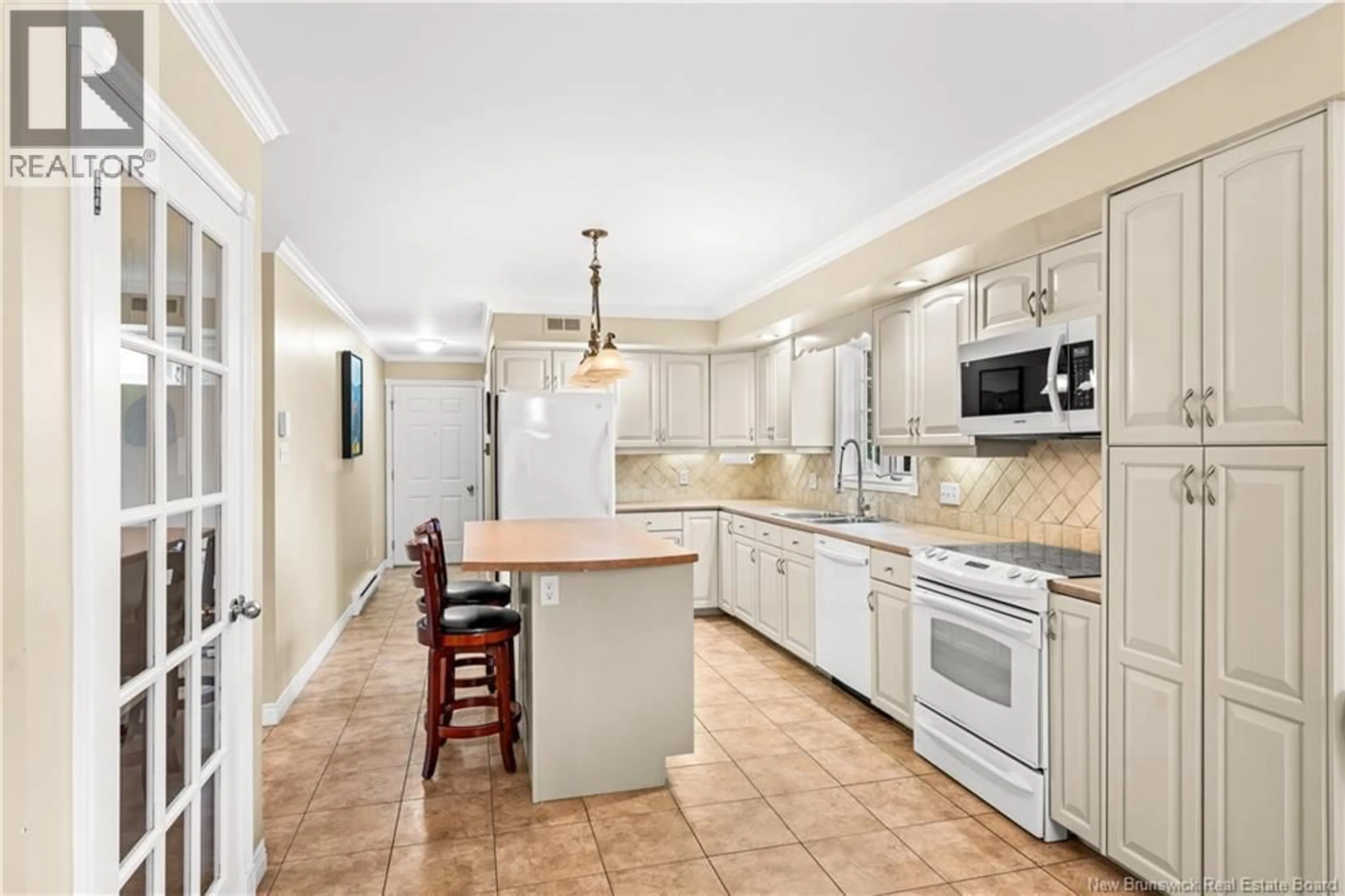 Open concept kitchen, ceramic/tile floor for 90 RUE ACADIE, Bouctouche New Brunswick E4S2T4