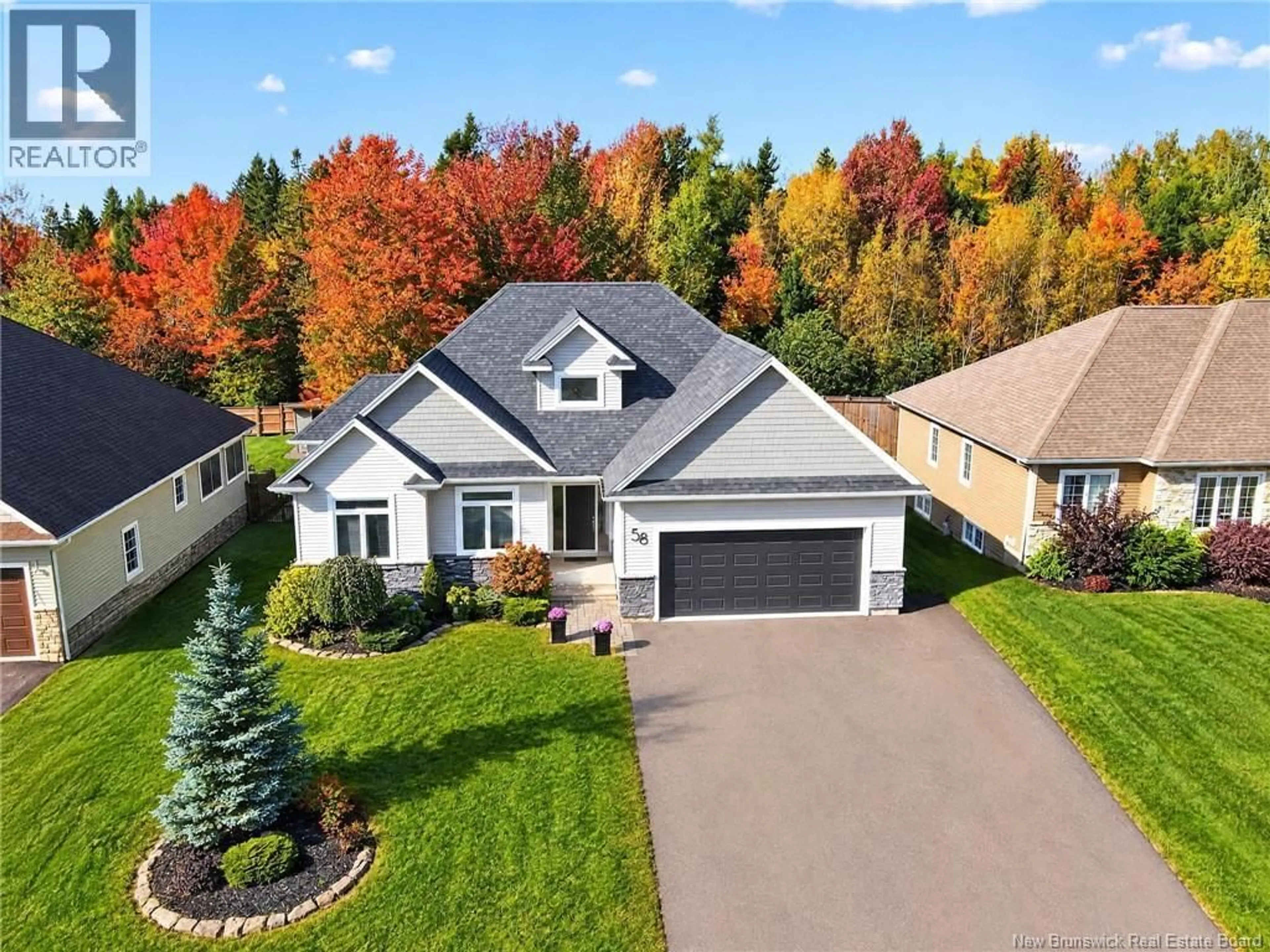 A pic from outside/outdoor area/front of a property/back of a property/a pic from drone, street for 58 VALMONT CRESCENT, Dieppe New Brunswick E1A1A2