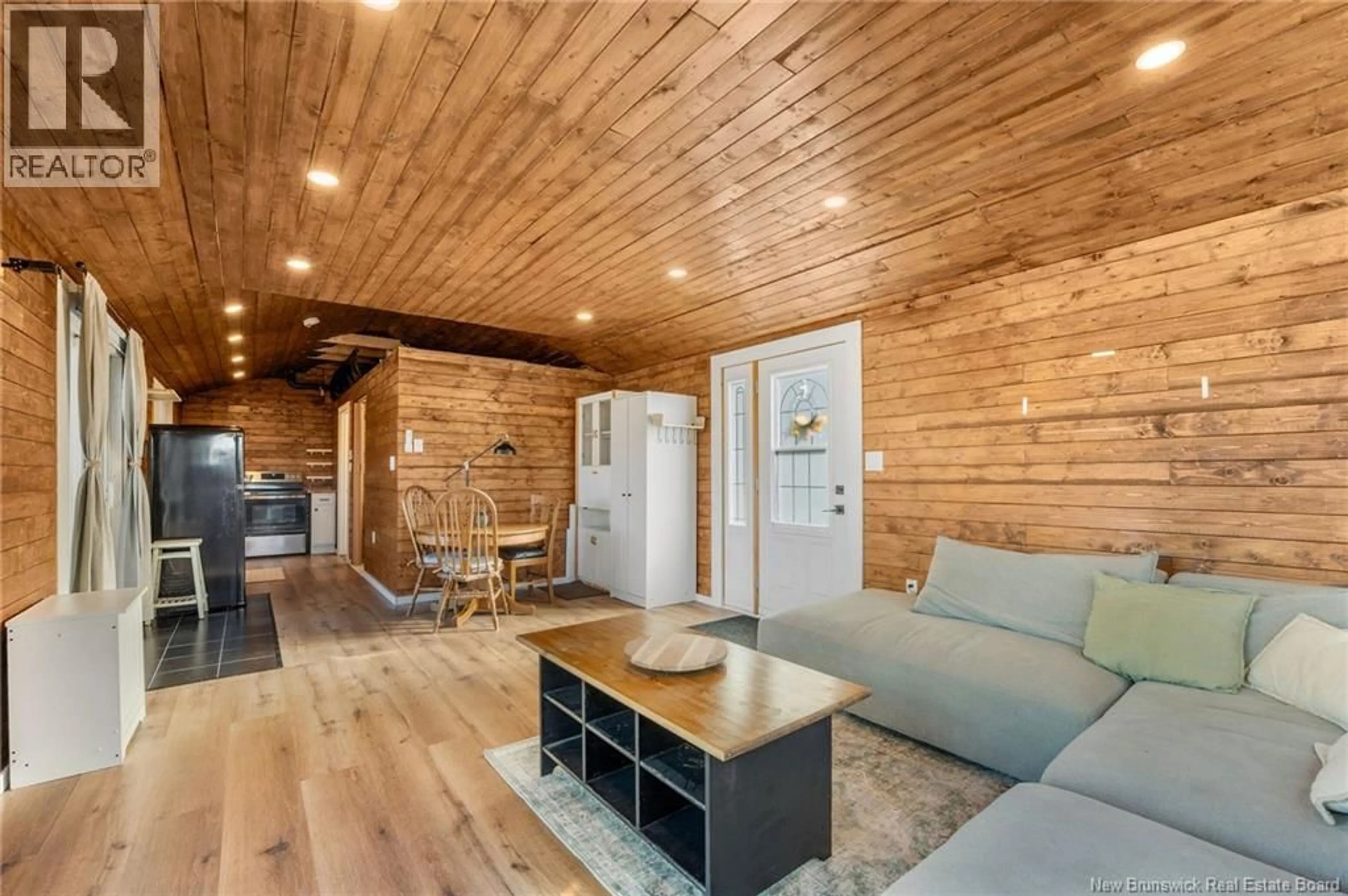 Living room with furniture, wood/laminate floor for 59 BARKER LANE, Longs Creek New Brunswick E6K4B3