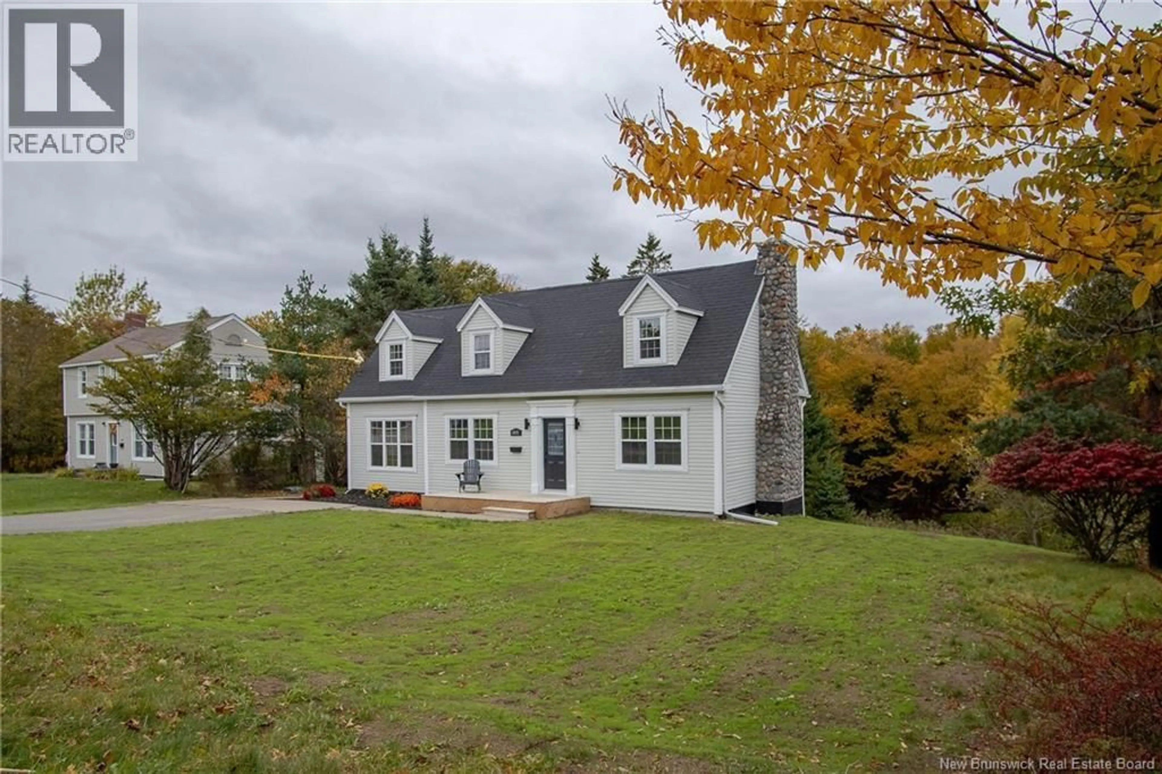 Home with vinyl exterior material, street for 1018 DEVER ROAD, Saint John New Brunswick E2M4J3