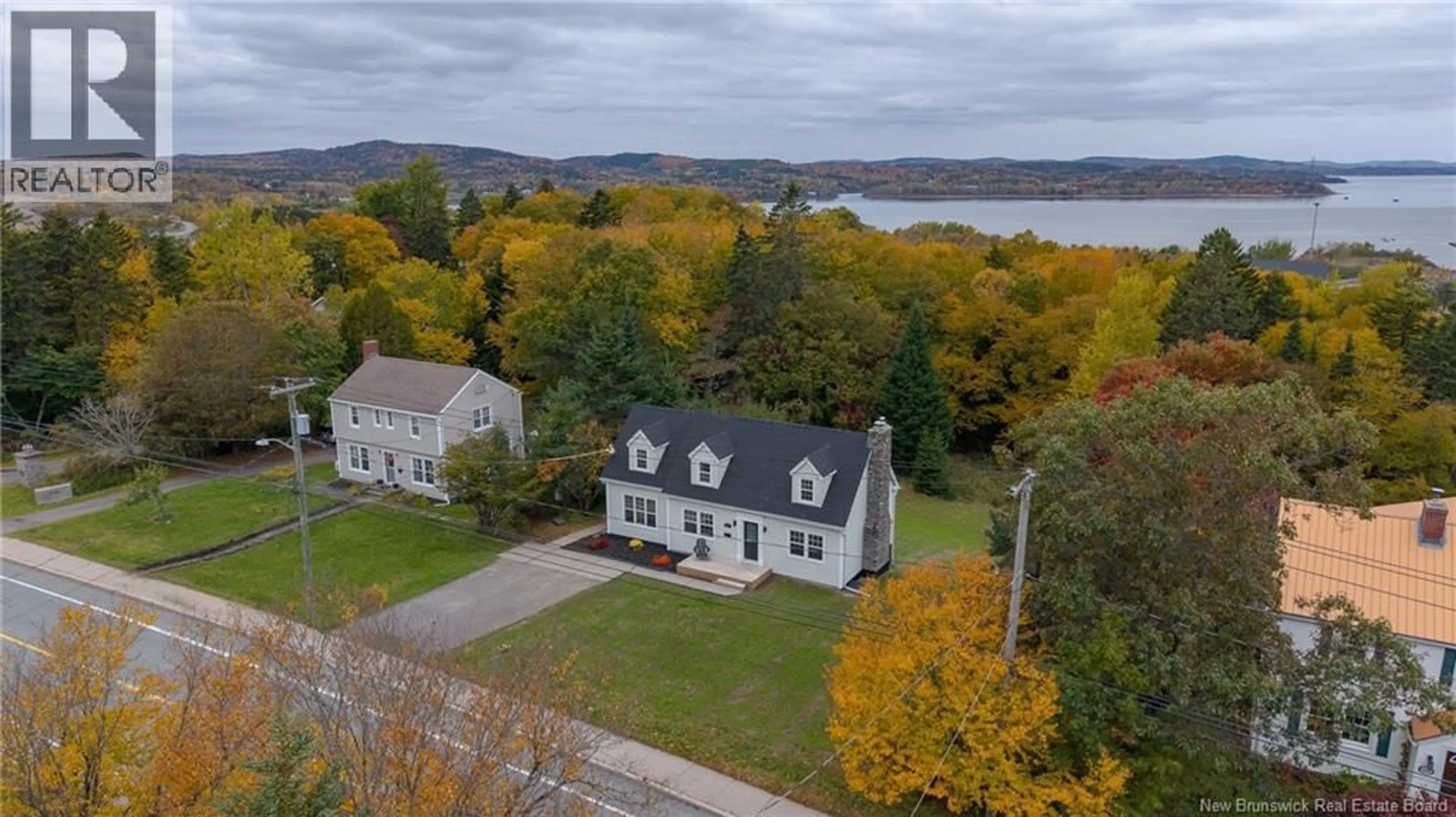 A pic from outside/outdoor area/front of a property/back of a property/a pic from drone, water/lake/river/ocean view for 1018 DEVER ROAD, Saint John New Brunswick E2M4J3