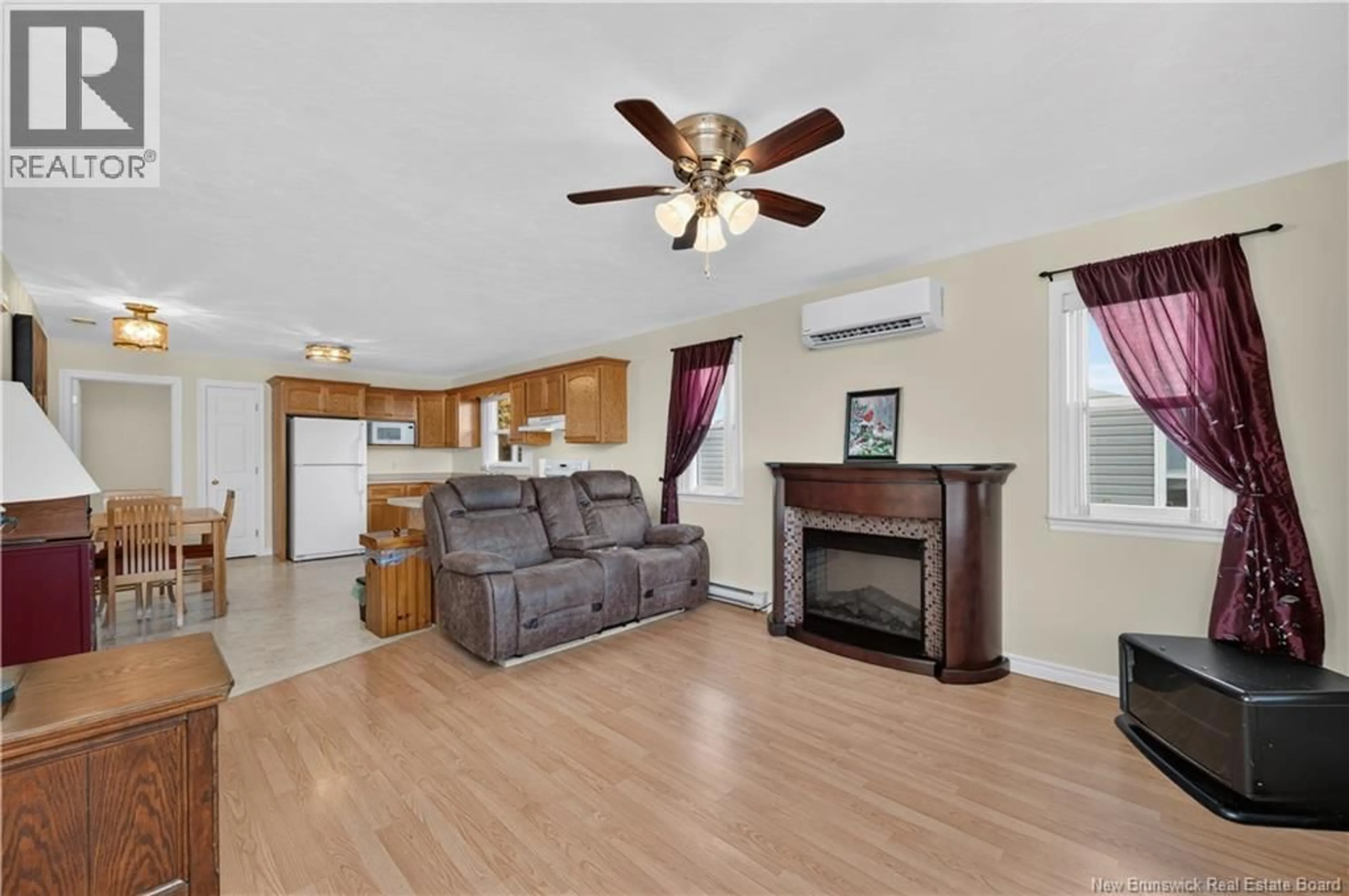 Living room with furniture, wood/laminate floor for 104 COLTON, Riverview New Brunswick E1B5T4