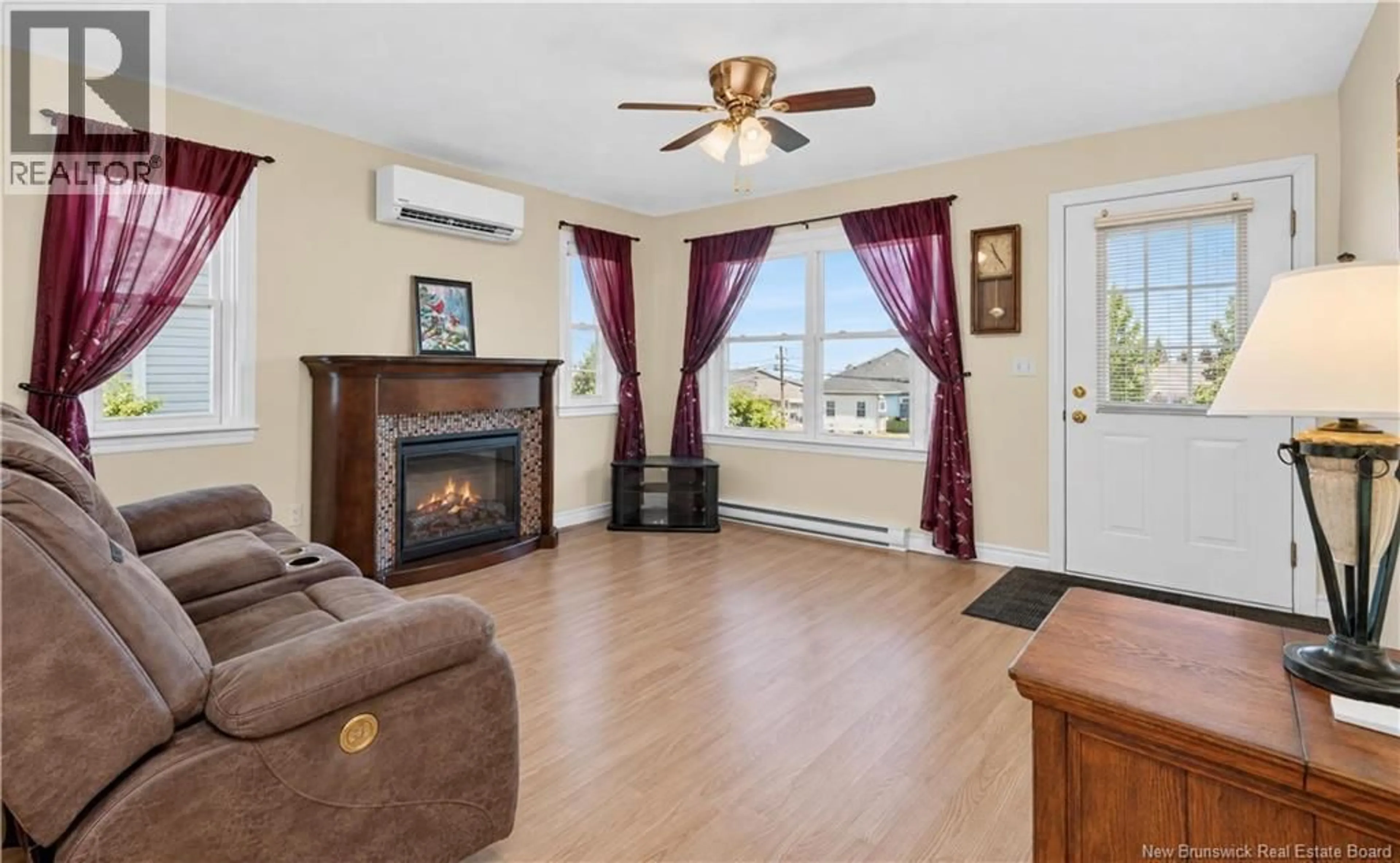 Living room with furniture, wood/laminate floor for 104 COLTON, Riverview New Brunswick E1B5T4