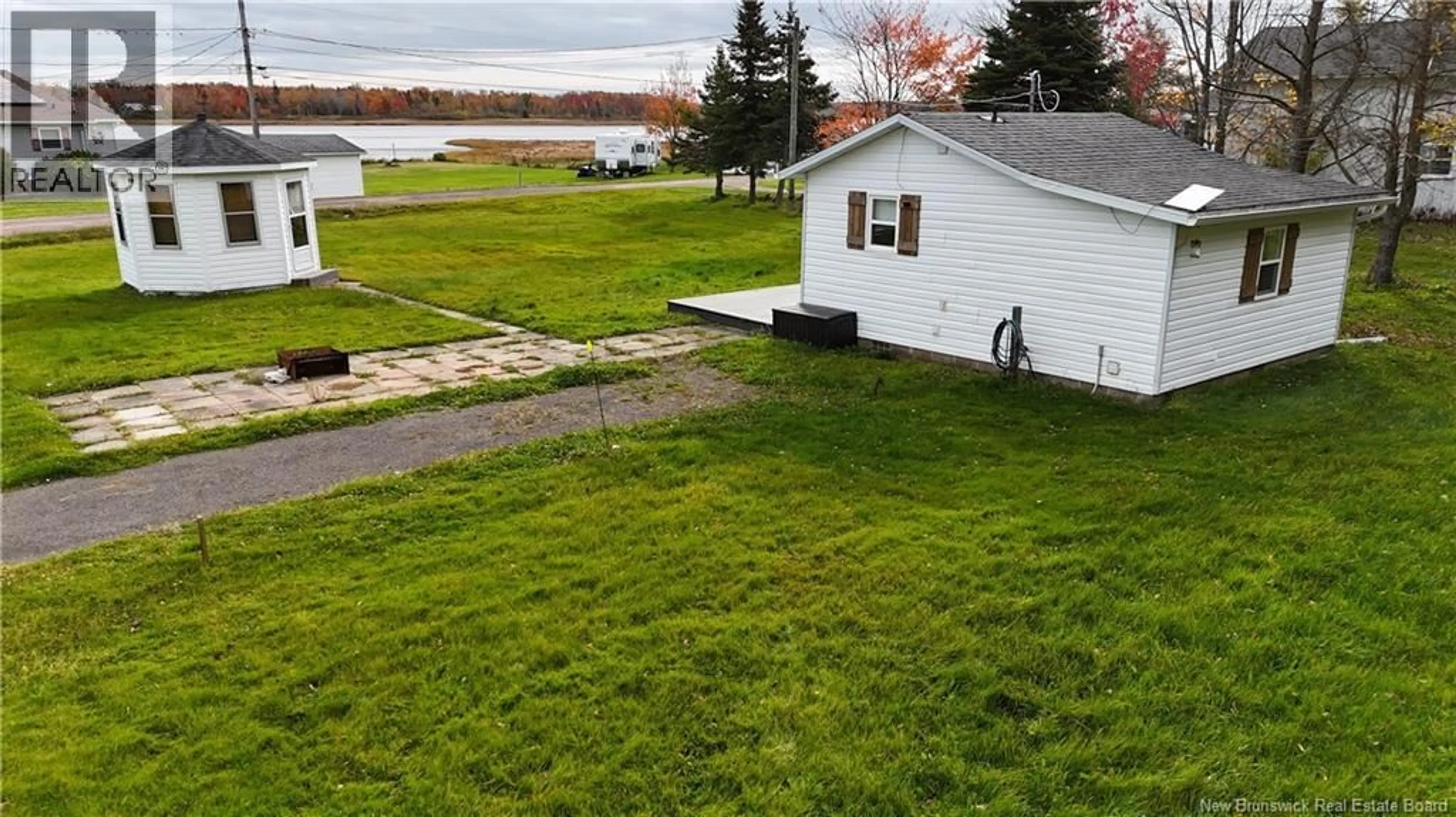 A pic from outside/outdoor area/front of a property/back of a property/a pic from drone, water/lake/river/ocean view for RIVERFRONT LANE, Grand-Barachois New Brunswick E4P8P4