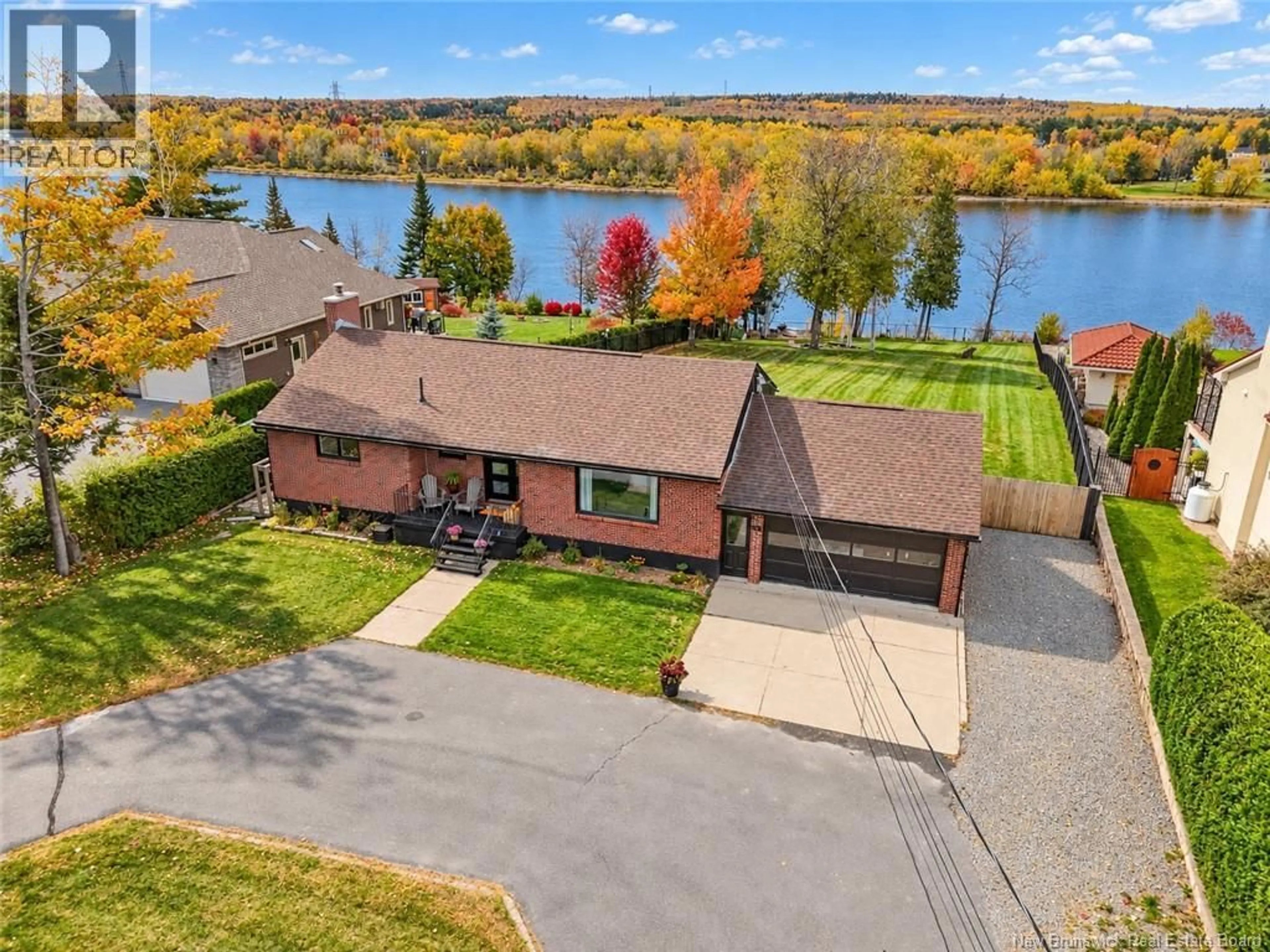 A pic from outside/outdoor area/front of a property/back of a property/a pic from drone, water/lake/river/ocean view for 1165 LINCOLN ROAD, Fredericton New Brunswick E3B8J3