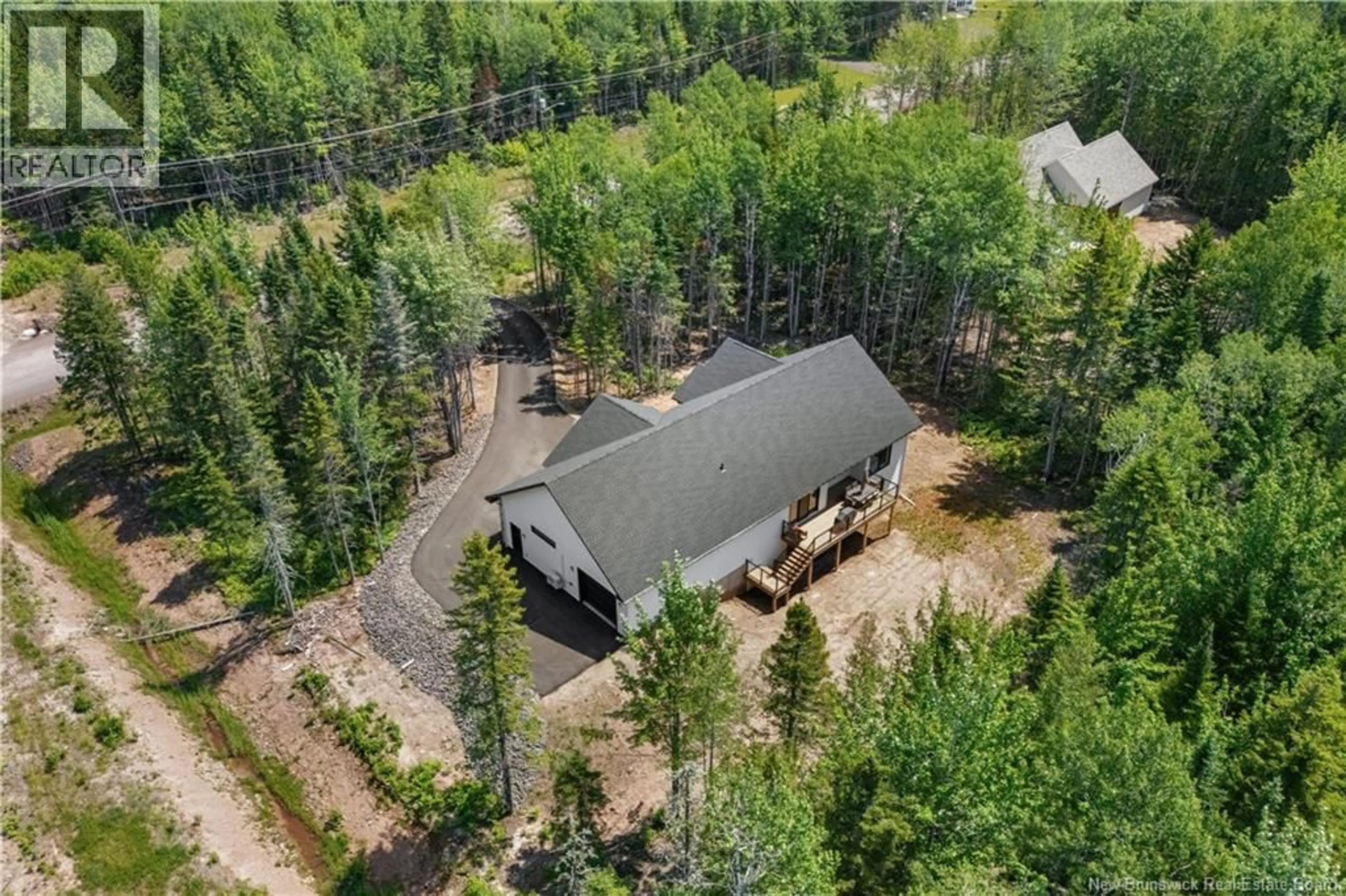 A pic from outside/outdoor area/front of a property/back of a property/a pic from drone, forest/trees view for 104 RUE PARIS STREET, Irishtown New Brunswick E1H0H8