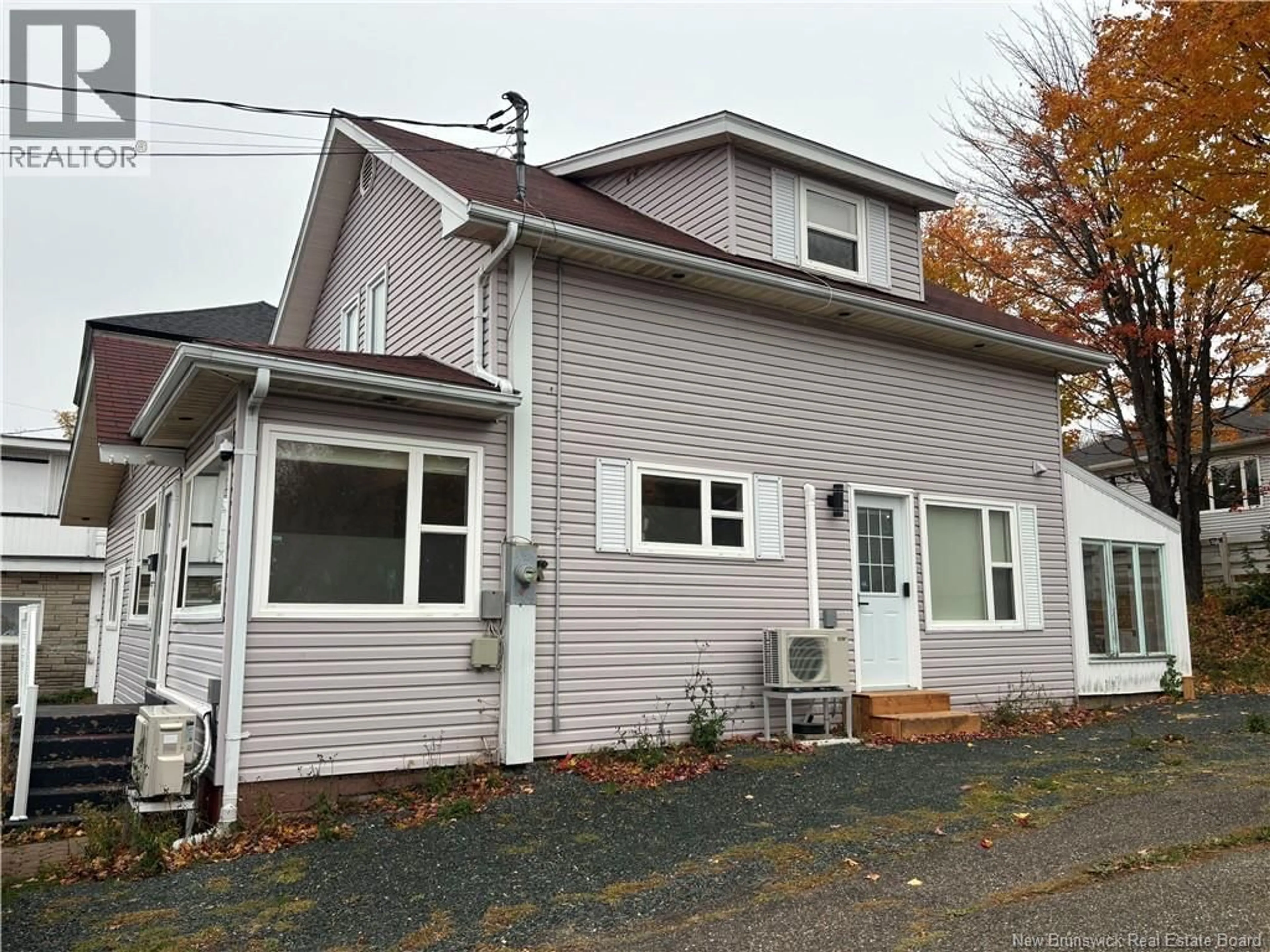 Home with vinyl exterior material, street for 310 RIVERSIDE DRIVE, Bathurst New Brunswick E2A2L9