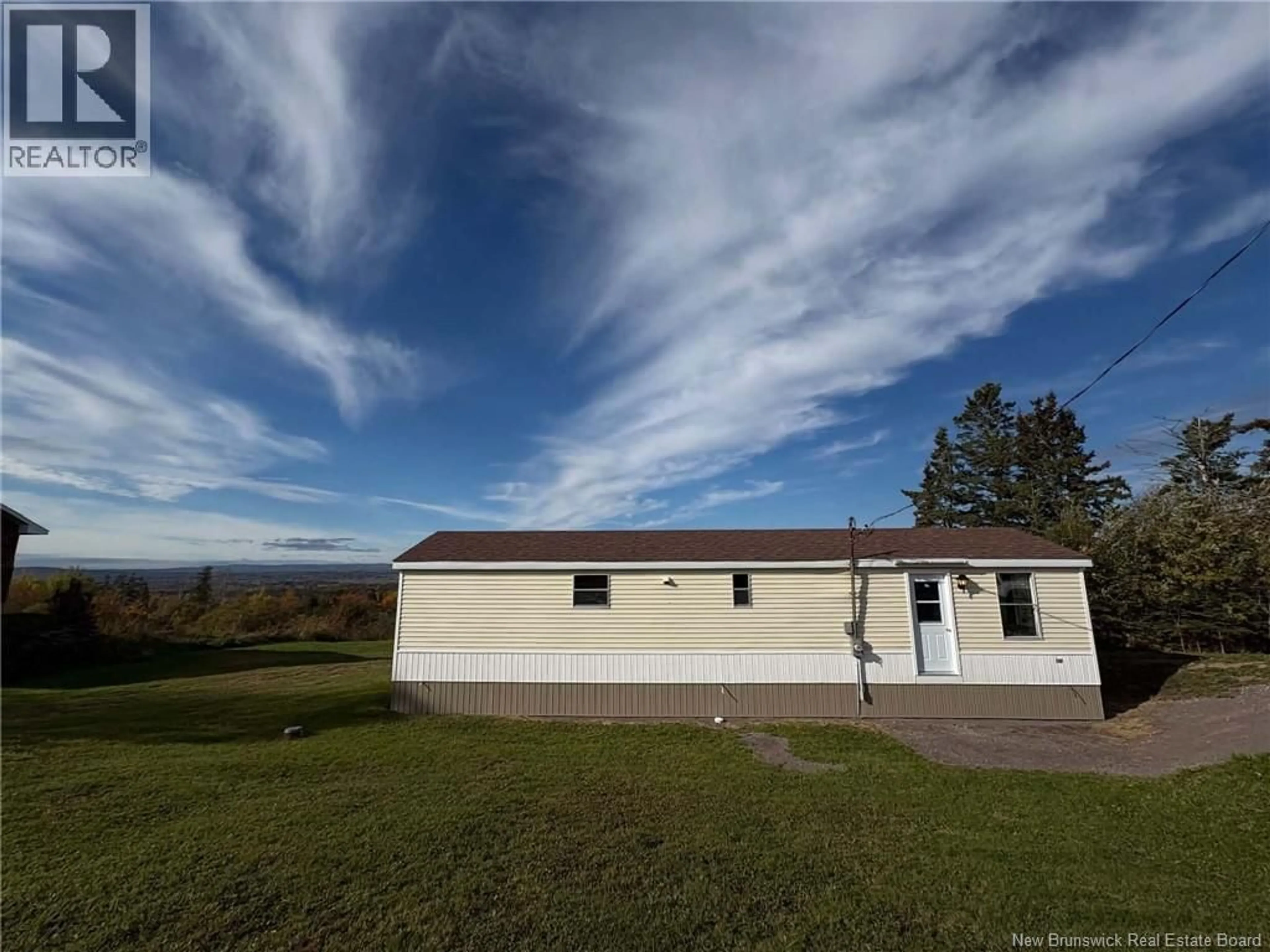 A pic from outside/outdoor area/front of a property/back of a property/a pic from drone, building for 402 MEMRAMCOOK EST RD, Memramcook East New Brunswick E4K1N6