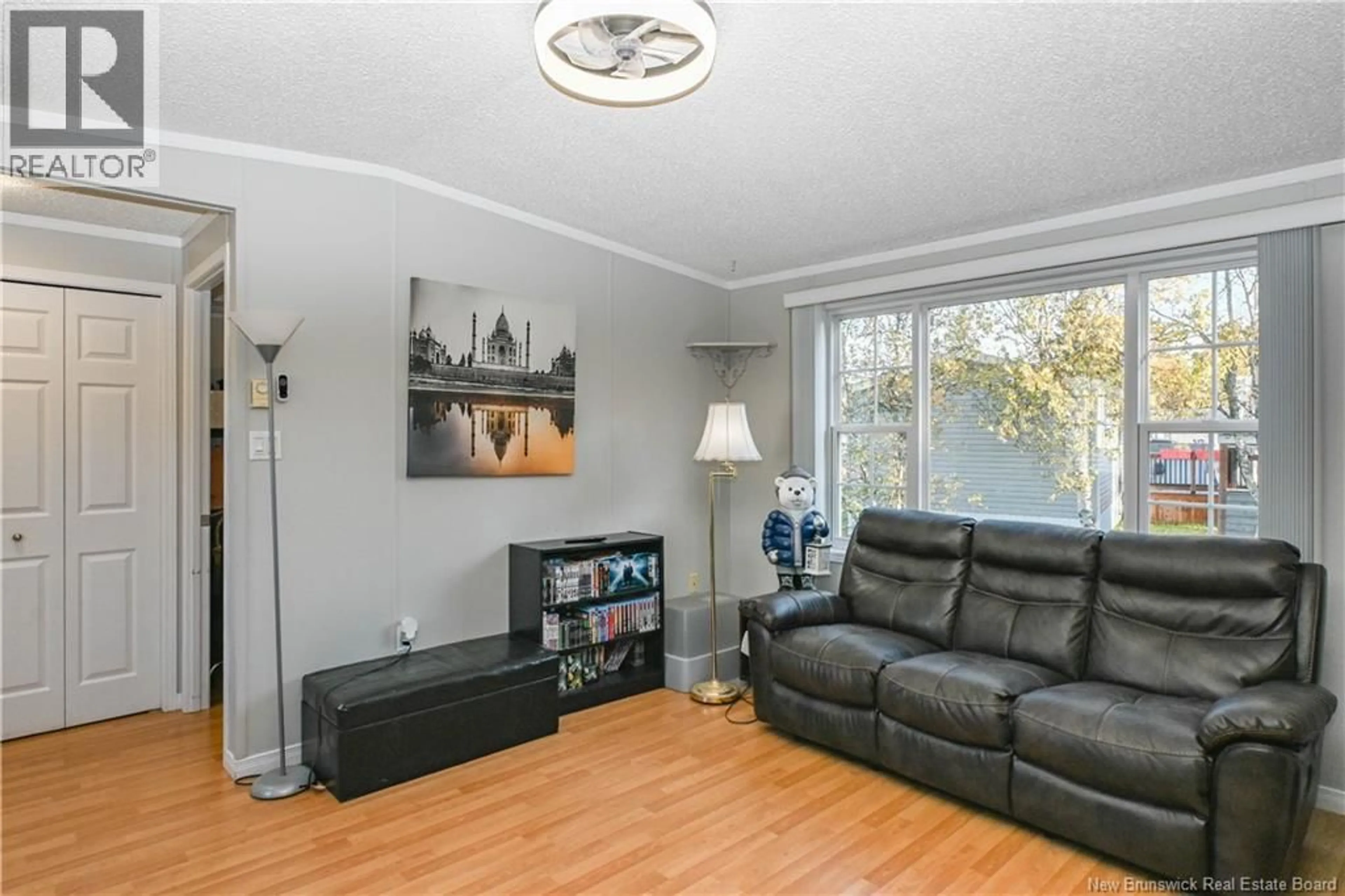 Living room with furniture, wood/laminate floor for 156 LEBLANC STREET, Shippagan New Brunswick E8S1X3