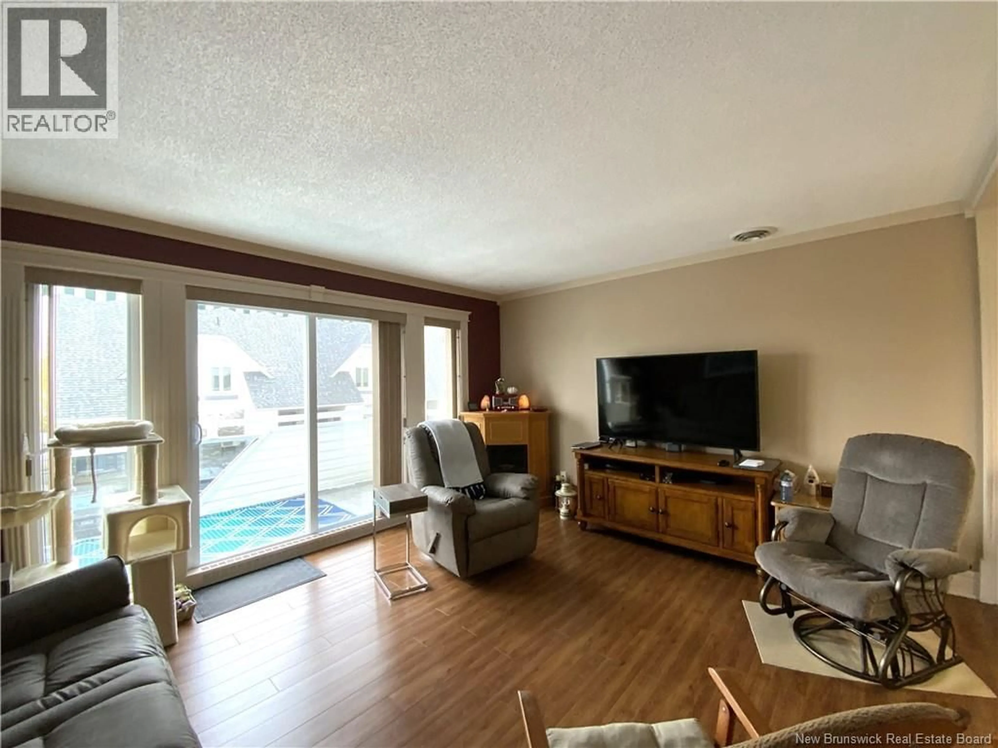 Living room with furniture, wood/laminate floor for H - 20 DU BOURG AVENUE, Edmundston New Brunswick E3V4C5