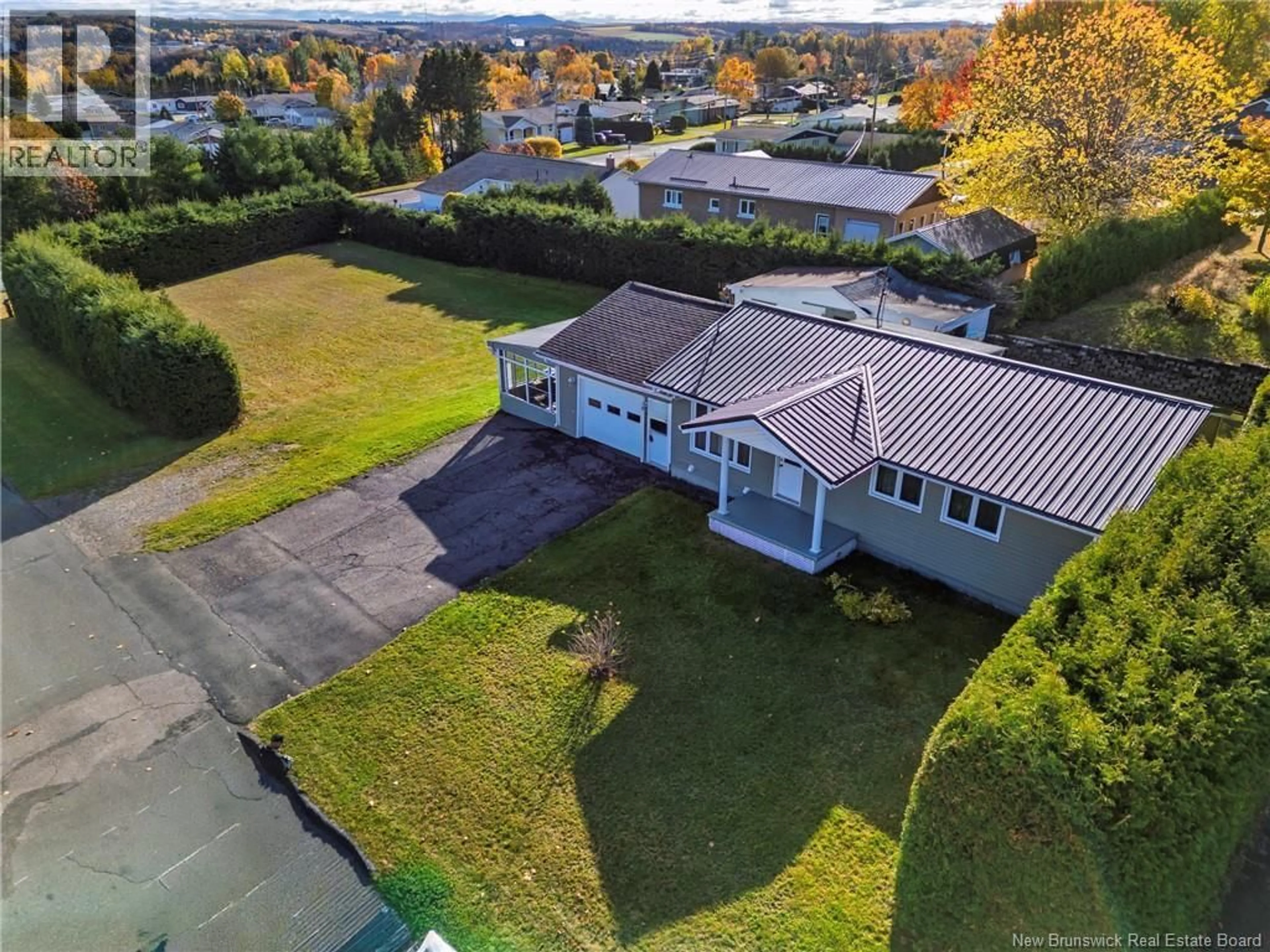 A pic from outside/outdoor area/front of a property/back of a property/a pic from drone, street for 605 5TH AVE, Grand Falls New Brunswick E3Z1A1