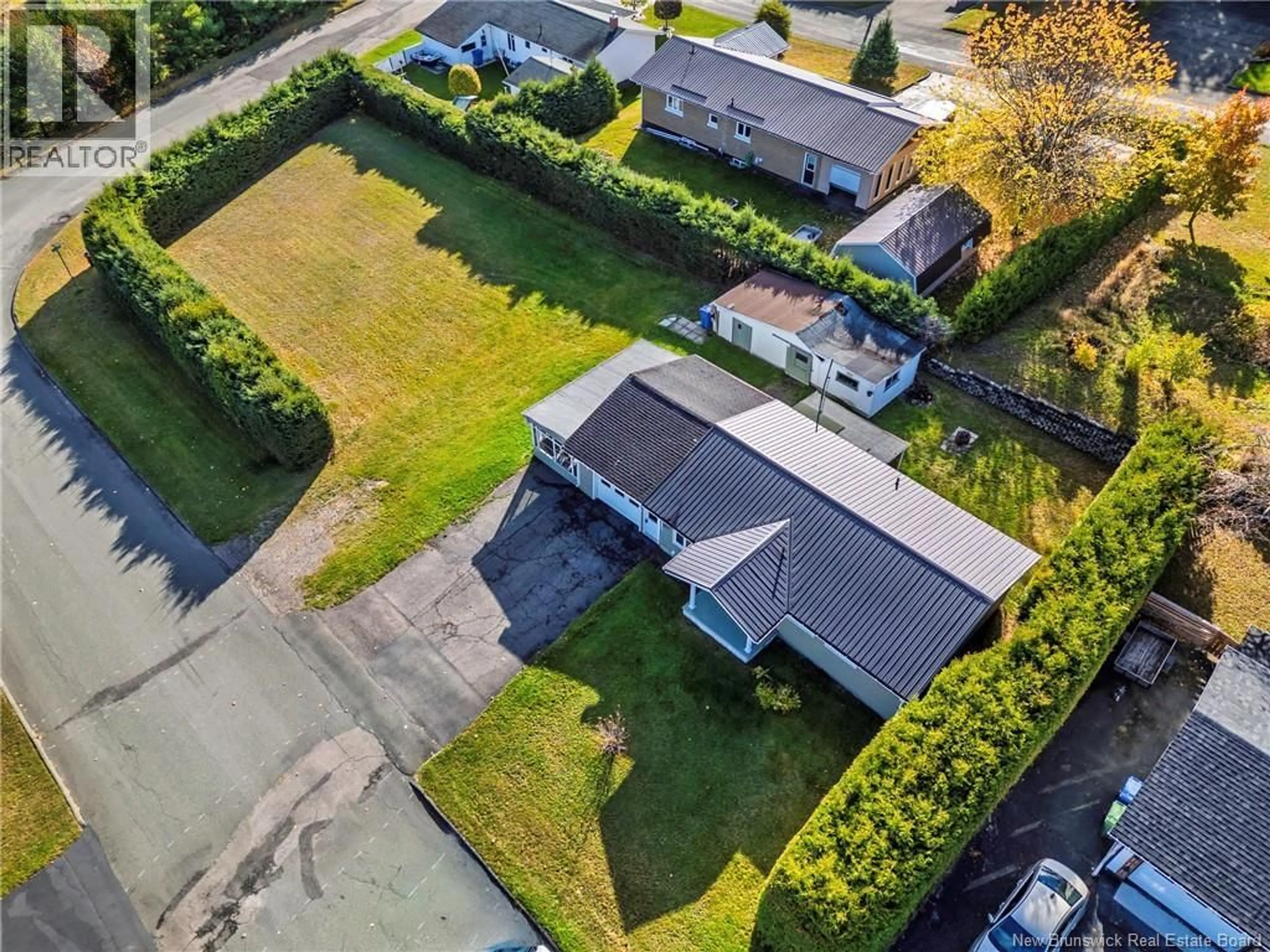 A pic from outside/outdoor area/front of a property/back of a property/a pic from drone, street for 605 5TH AVE, Grand Falls New Brunswick E3Z1A1