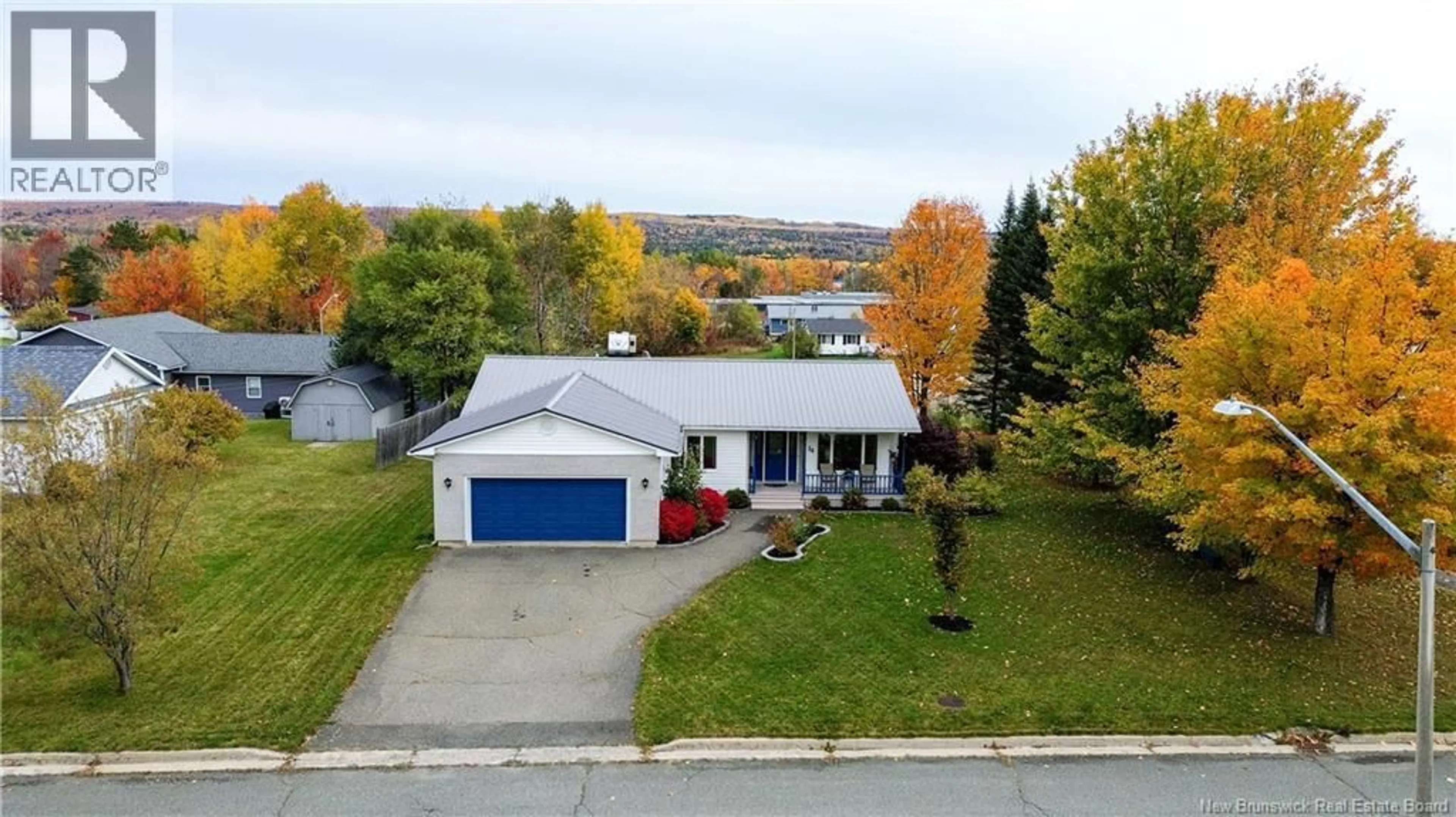 A pic from outside/outdoor area/front of a property/back of a property/a pic from drone, street for 34 DOYLE STREET, Nackawic New Brunswick E6G1E5