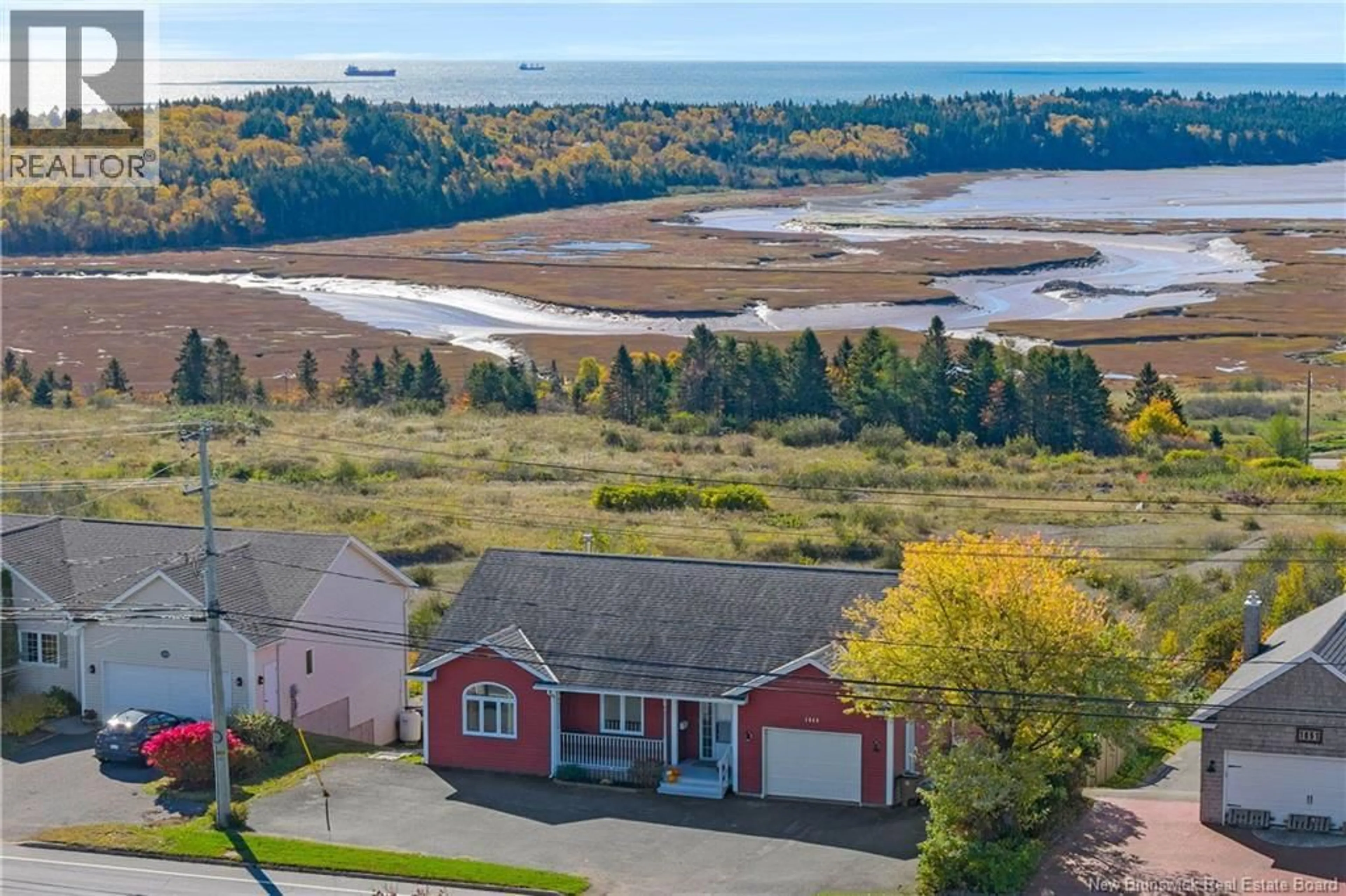 A pic from outside/outdoor area/front of a property/back of a property/a pic from drone, water/lake/river/ocean view for 1849 MANAWAGONISH ROAD, Saint John New Brunswick E2M3R9