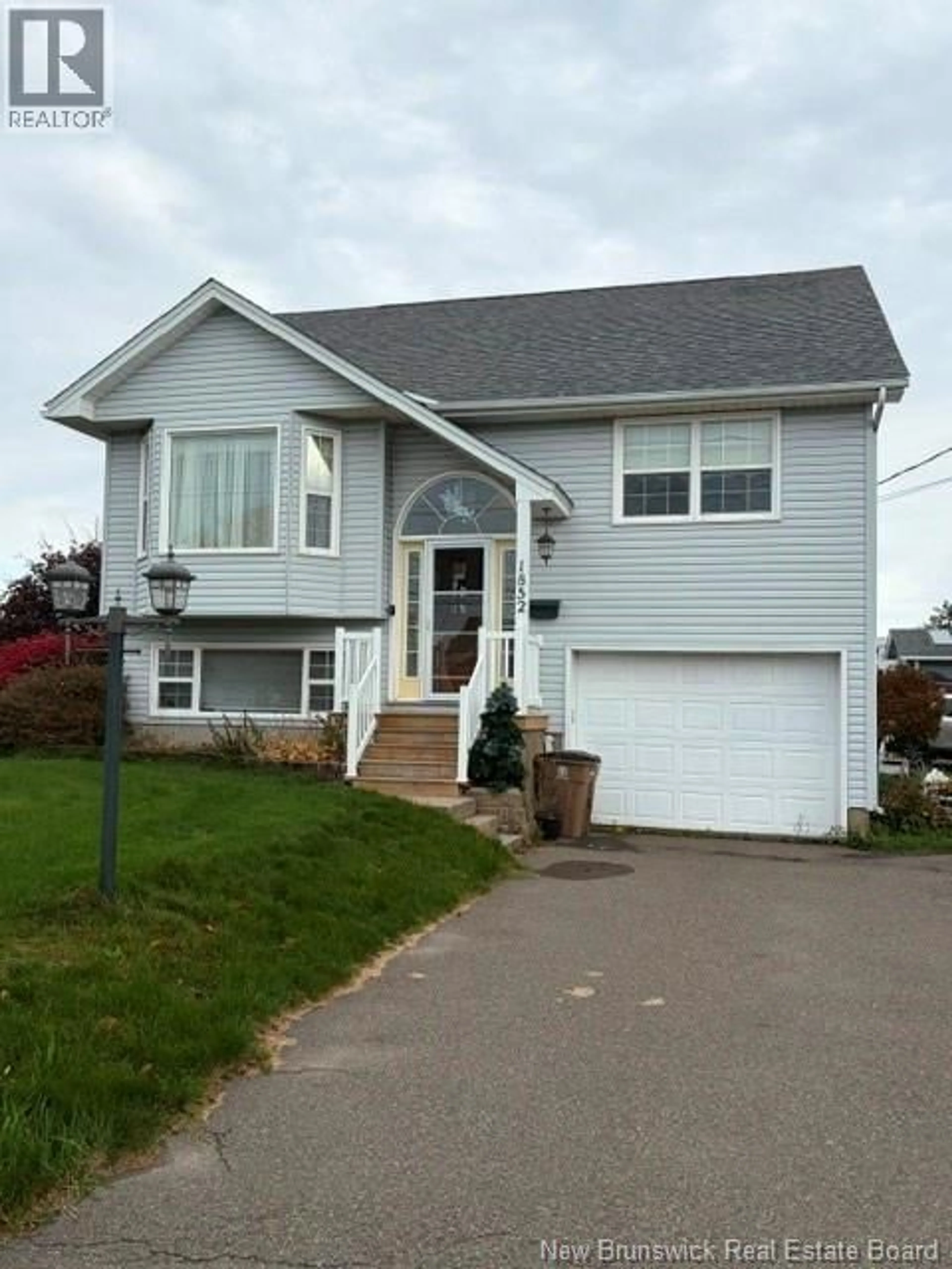 Home with vinyl exterior material, street for 1852 MANAWAGONISH ROAD, Saint John New Brunswick E2M3Y5