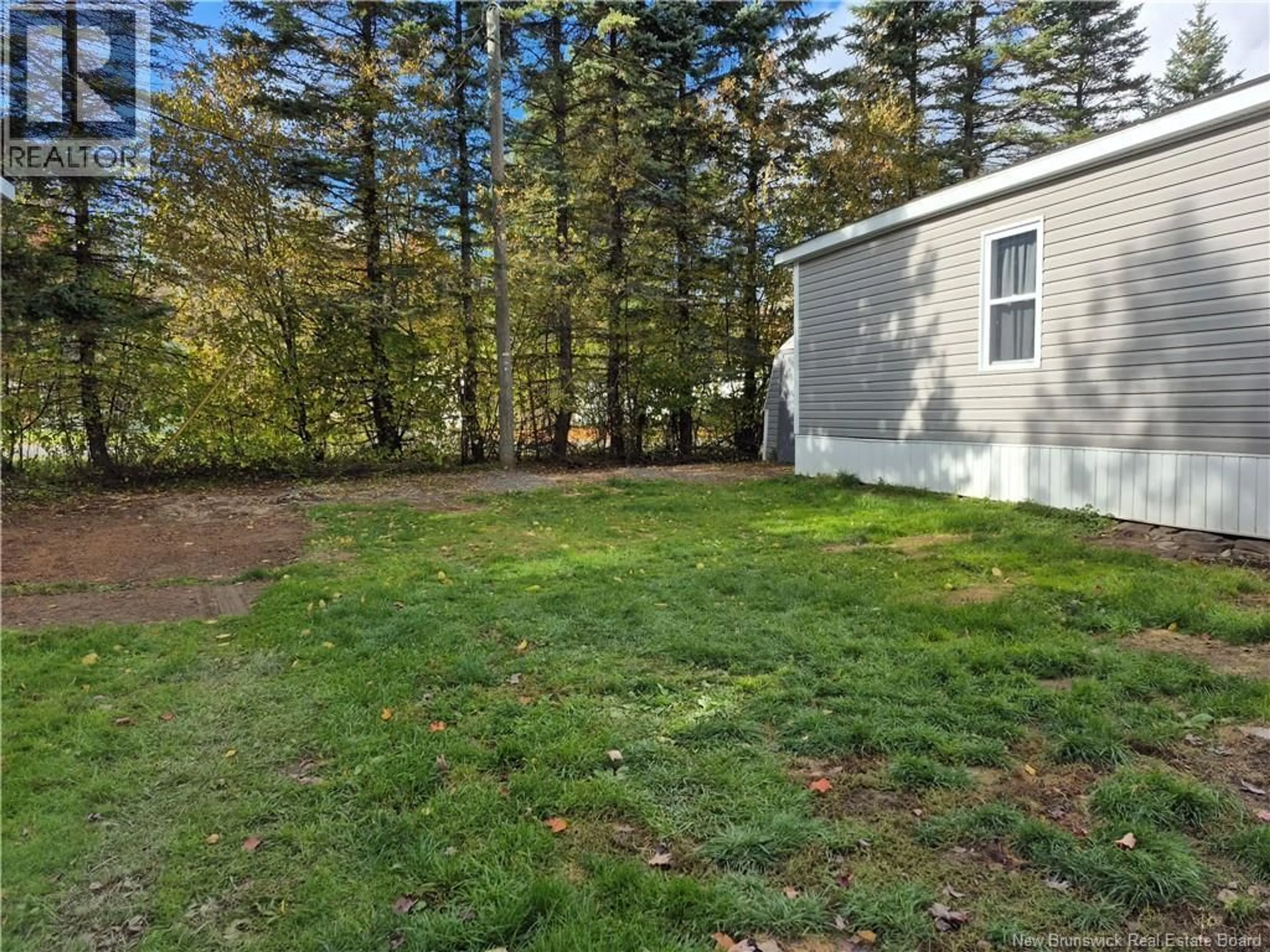 A pic from outside/outdoor area/front of a property/back of a property/a pic from drone, forest/trees view for 59 TAMARACK DRIVE, Lincoln New Brunswick E3B6V2