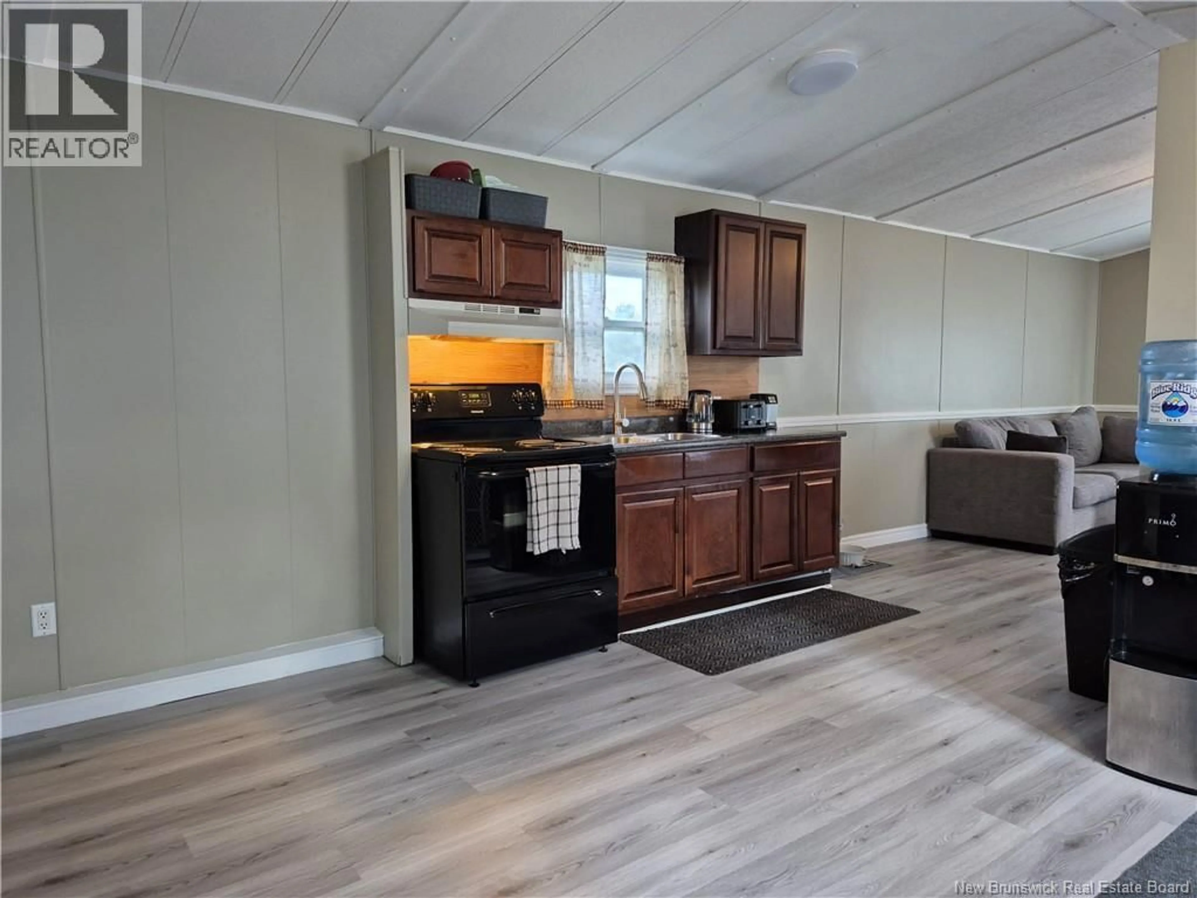 Open concept kitchen, wood/laminate floor for 59 TAMARACK DRIVE, Lincoln New Brunswick E3B6V2