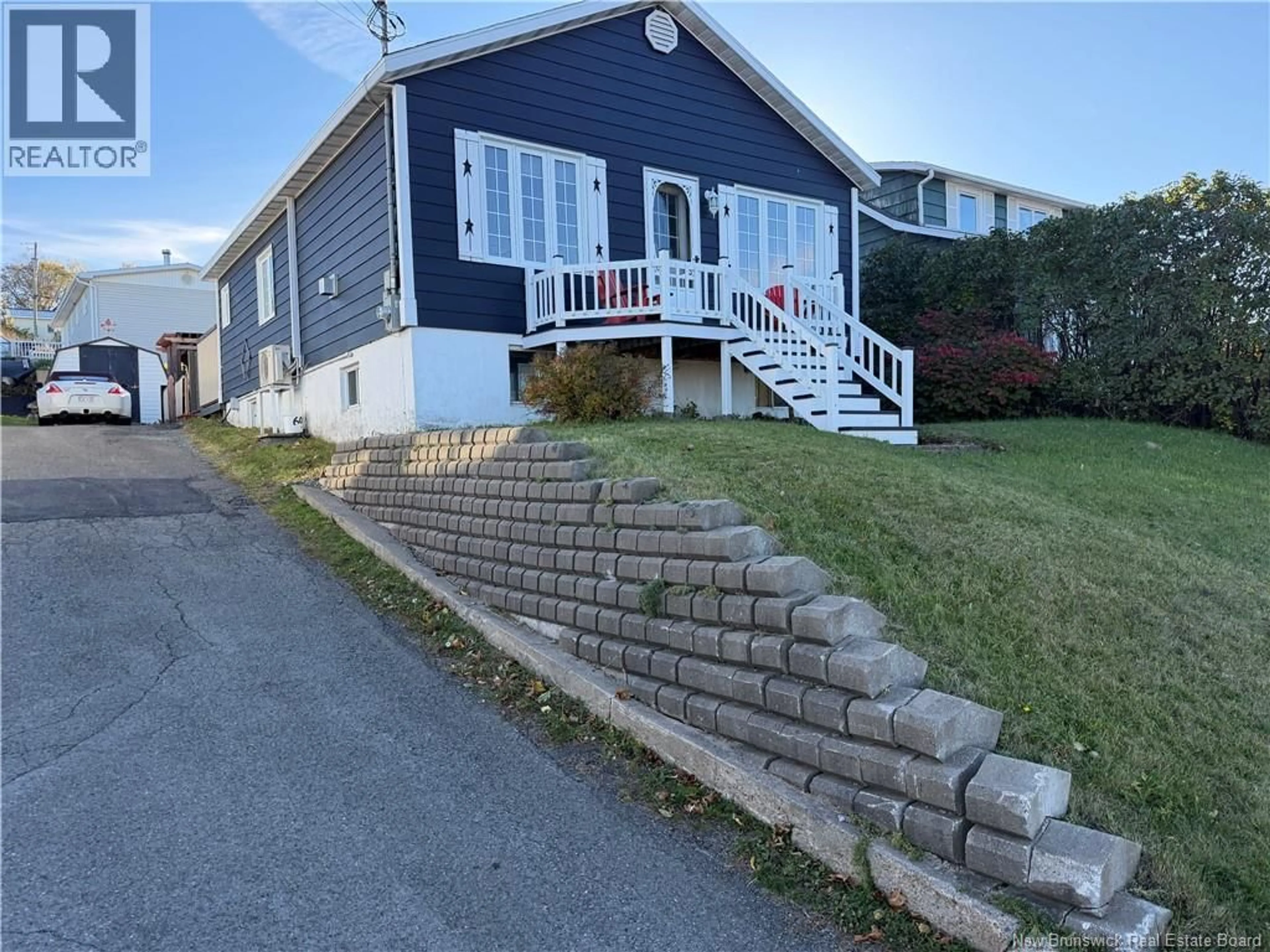 Home with vinyl exterior material, street for 390 VICTORIA STREET, Dalhousie New Brunswick E8C2S4