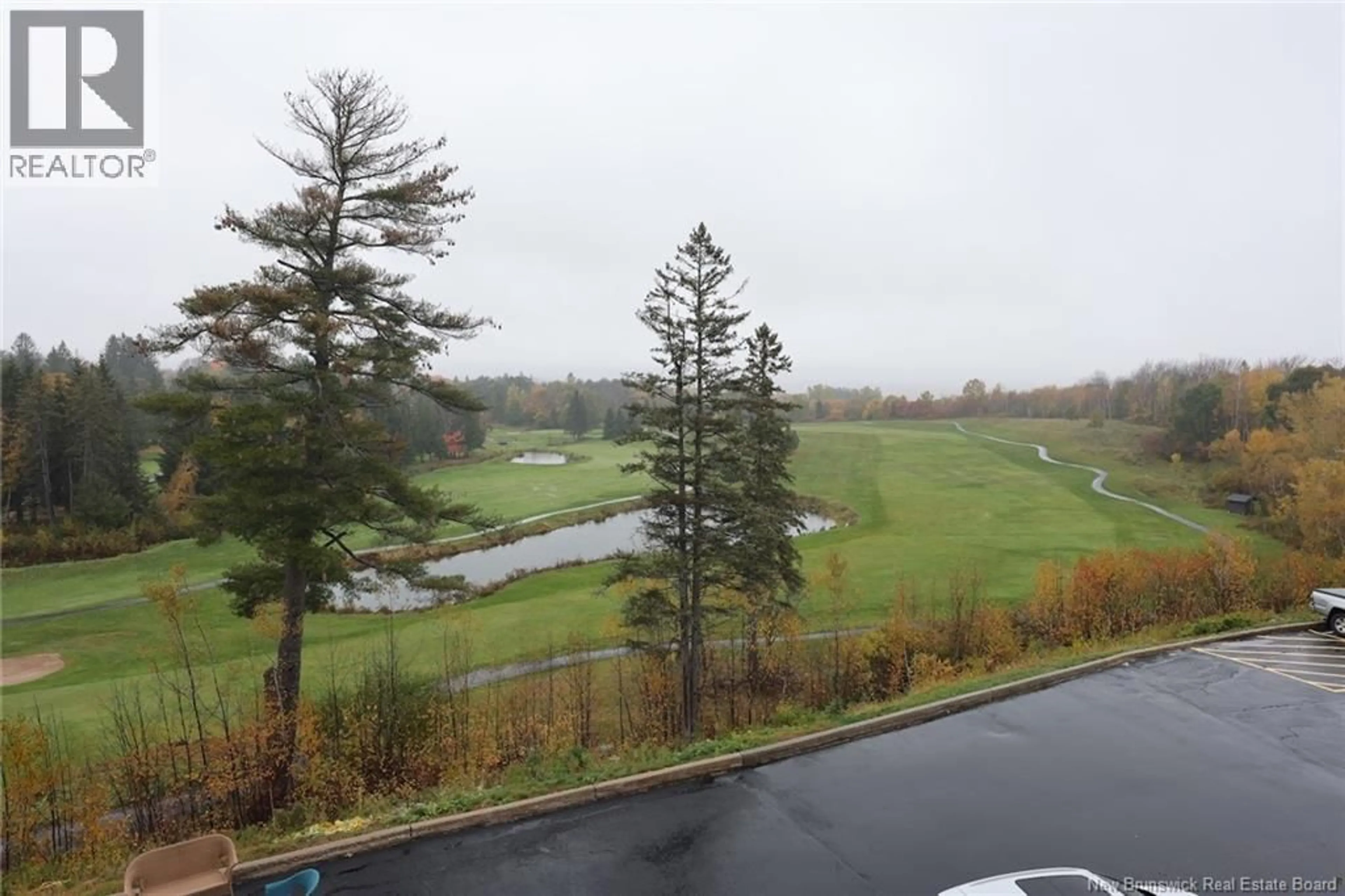 A pic from outside/outdoor area/front of a property/back of a property/a pic from drone, water/lake/river/ocean view for 213 - 1 GOLF GREENS LANE, Fredericton New Brunswick E3B9T9