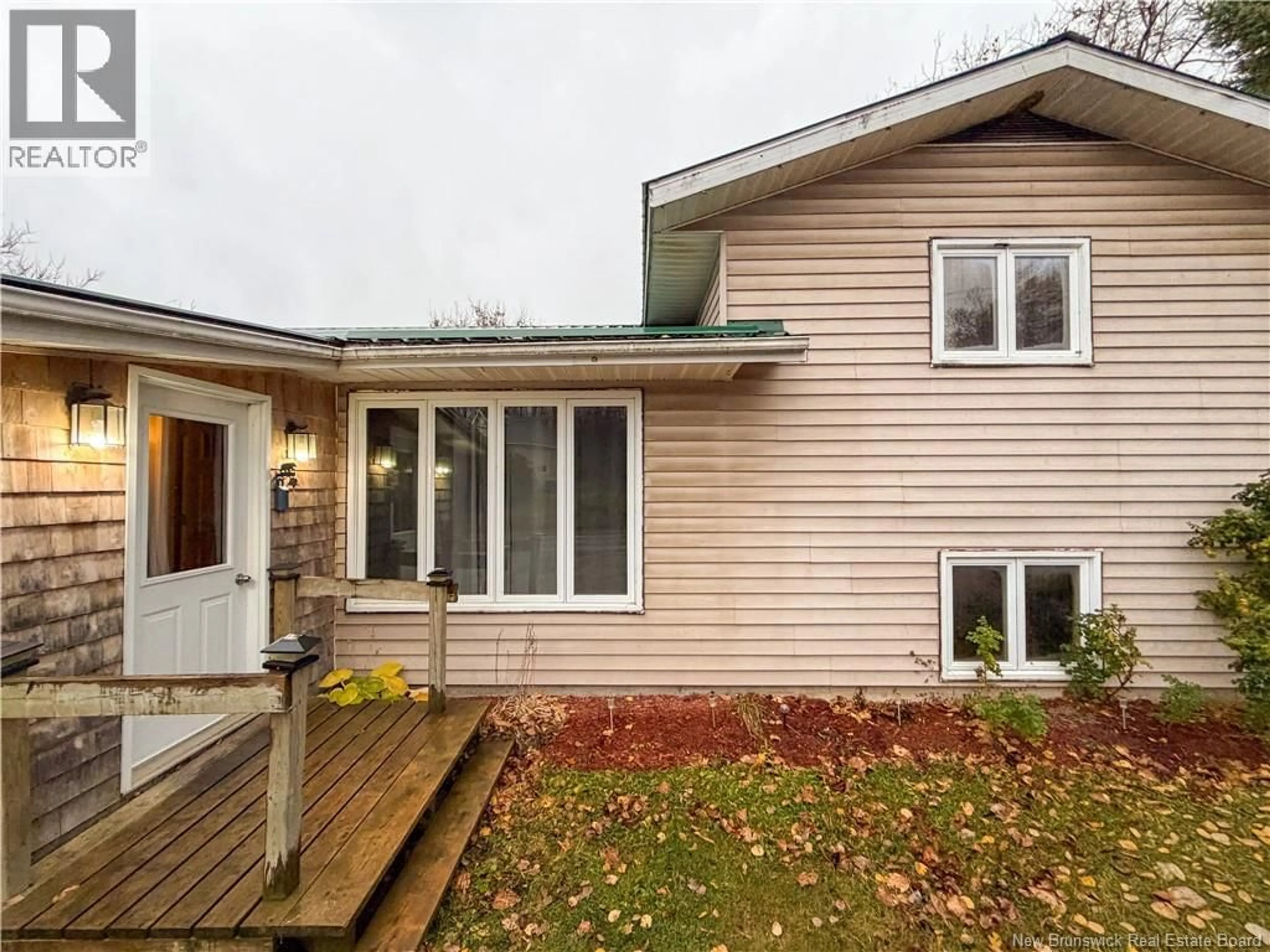 Home with vinyl exterior material, street for 403 TOBIQUE STREET, Plaster Rock New Brunswick E7G4A1