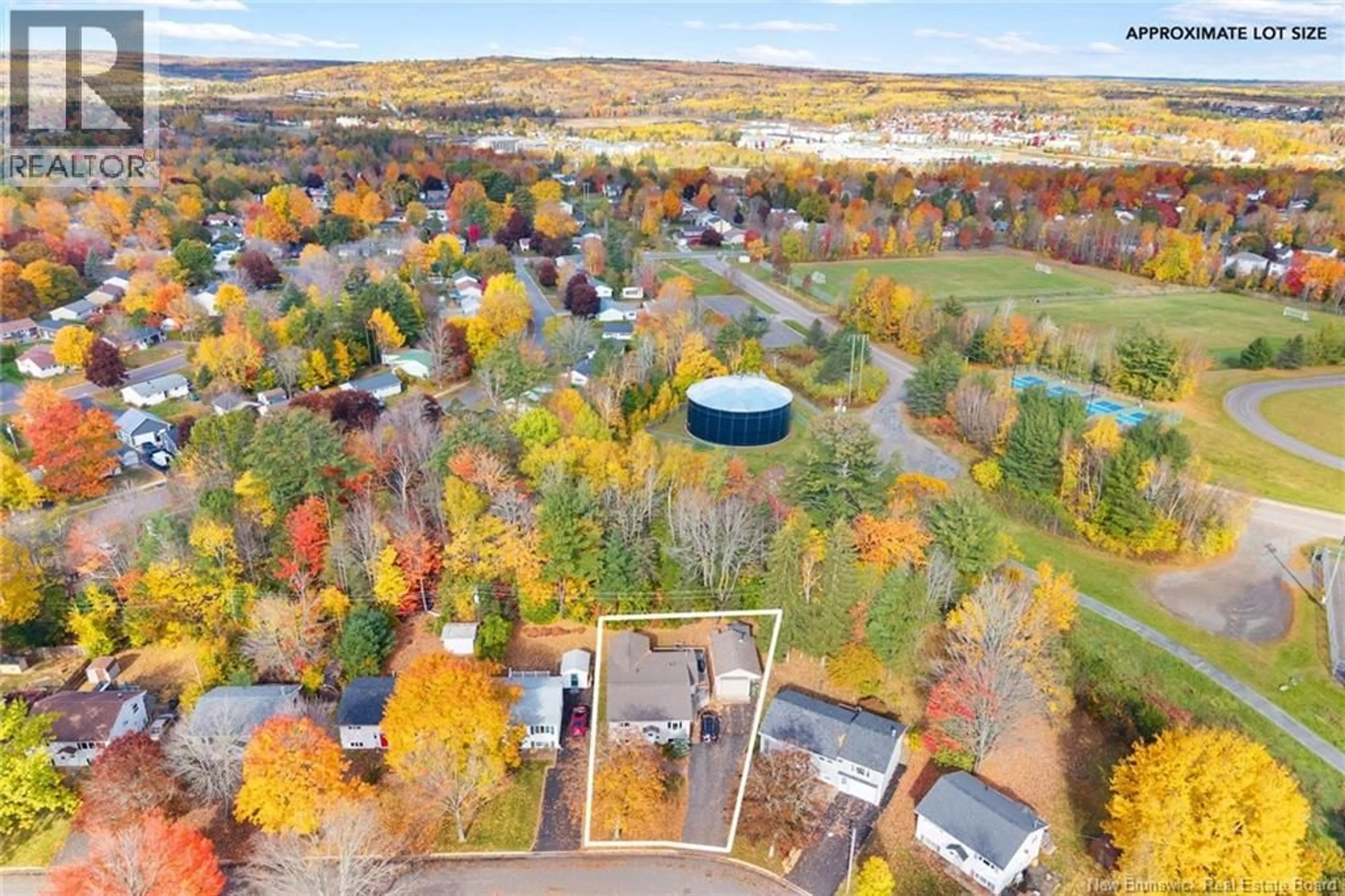 A pic from outside/outdoor area/front of a property/back of a property/a pic from drone, water/lake/river/ocean view for 15 LILAC CRESCENT, Fredericton New Brunswick E3A2G7