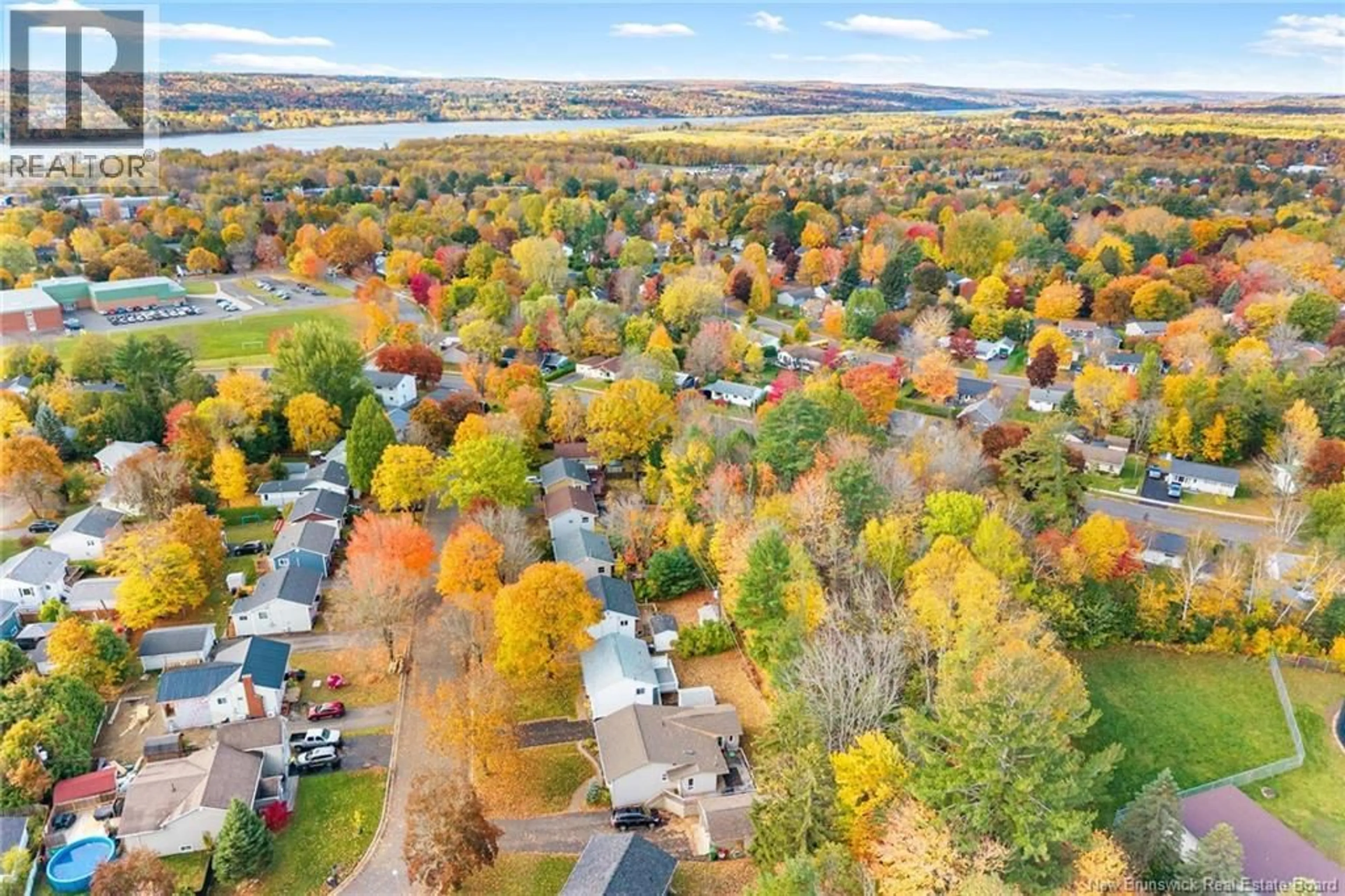 A pic from outside/outdoor area/front of a property/back of a property/a pic from drone, water/lake/river/ocean view for 15 LILAC CRESCENT, Fredericton New Brunswick E3A2G7
