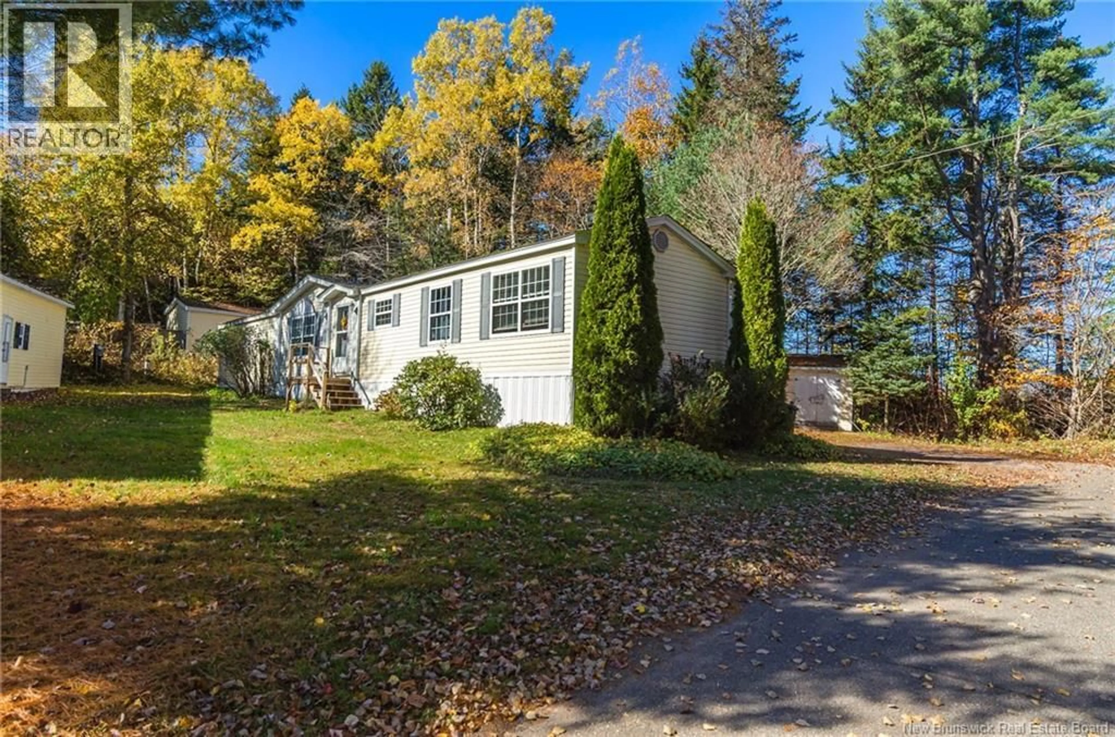 Home with vinyl exterior material, street for 84 BUTTERNUT LANE, Quispamsis New Brunswick E2G1X5