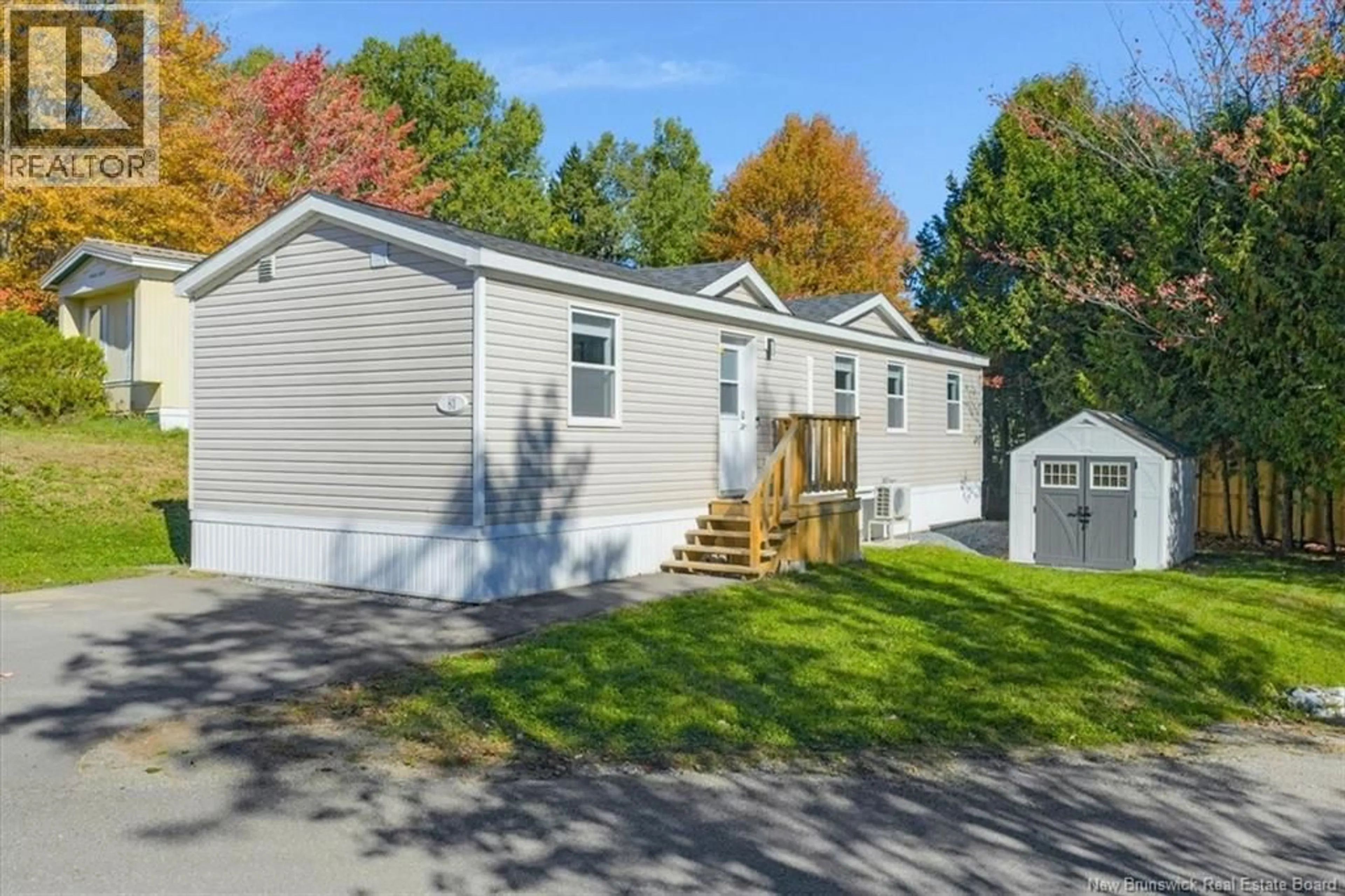 Home with vinyl exterior material, street for 83 HOLLY LANE, Quispamsis New Brunswick E2G1X7