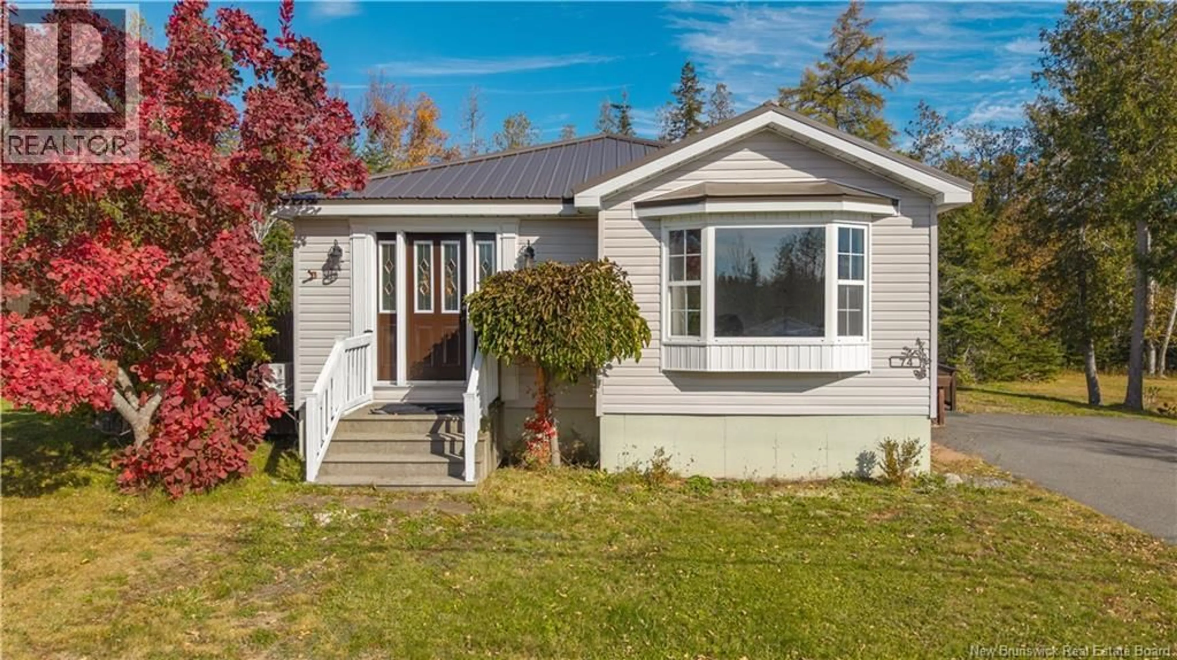Home with vinyl exterior material, street for 74 DIANA DRIVE, Saint Andrews New Brunswick E5B3W6